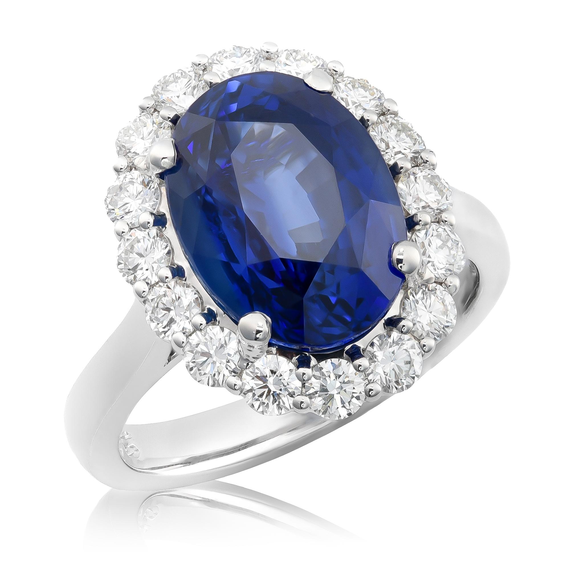 Discover the breathtaking allure of this exquisite 18K white gold ring, featuring a magnificent natural unheated blue sapphire accented with sparkling diamonds. The vivid blue hue of the sapphire, coupled with its substantial size and superior