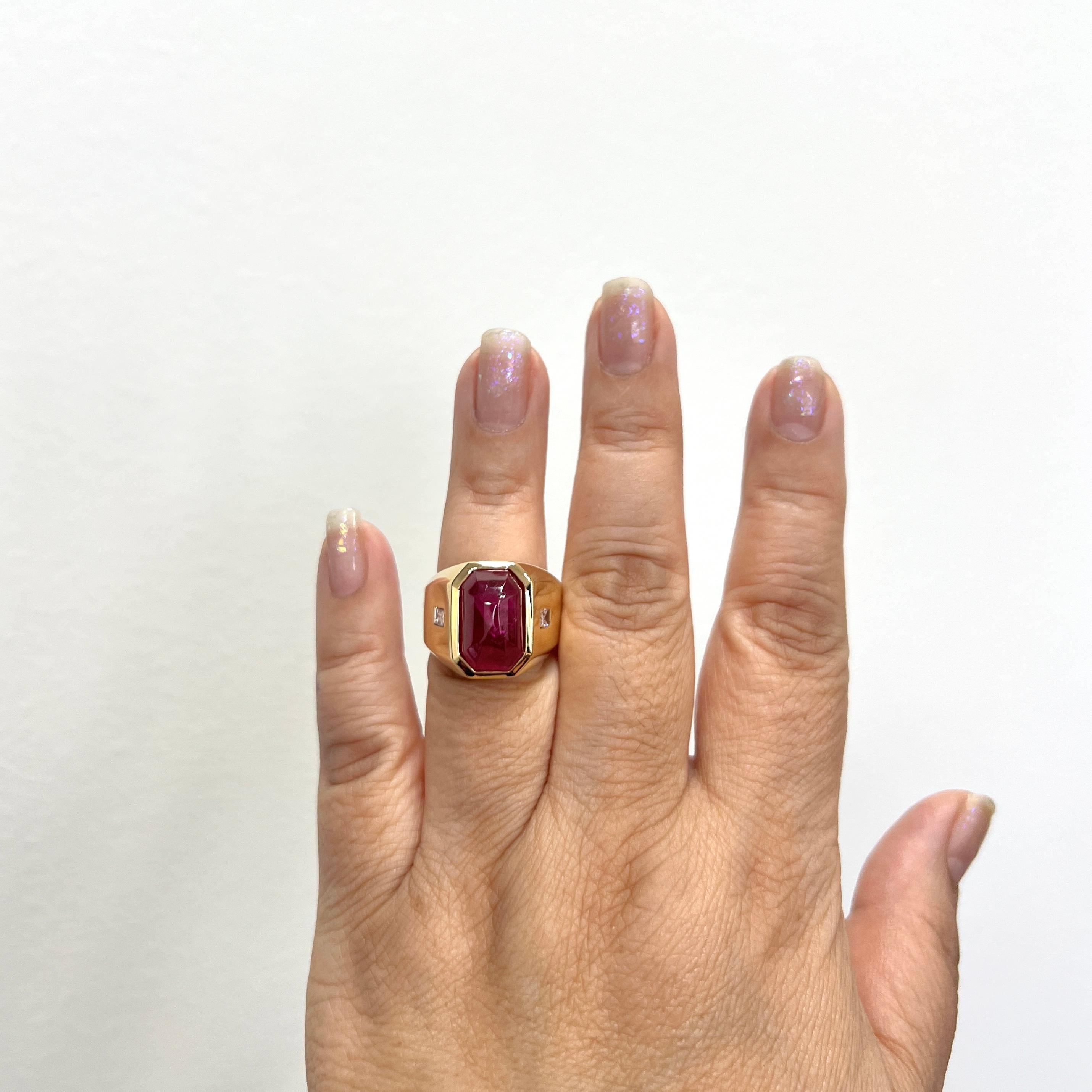 Beautiful 10.75 ct. unheated Burma ruby sugarloaf with two good quality white diamond baguettes.  Handmade in 18k yellow gold.  Ring size 7.25.