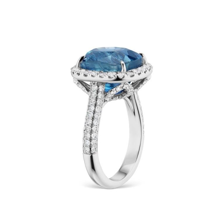 UNHEATED BURMESE BLUE SAPPHIRE RING WITH DIAMONDS An exquisite snowy diamond halo surrounds a luscious 12 ct Unheated Burmese Blue Sapphire. (AGL and GRS Certified) Item: # 03398 Metal: 18k W Lab: Grs And Agl Color Weight: 12.57 ct. Diamond Weight: