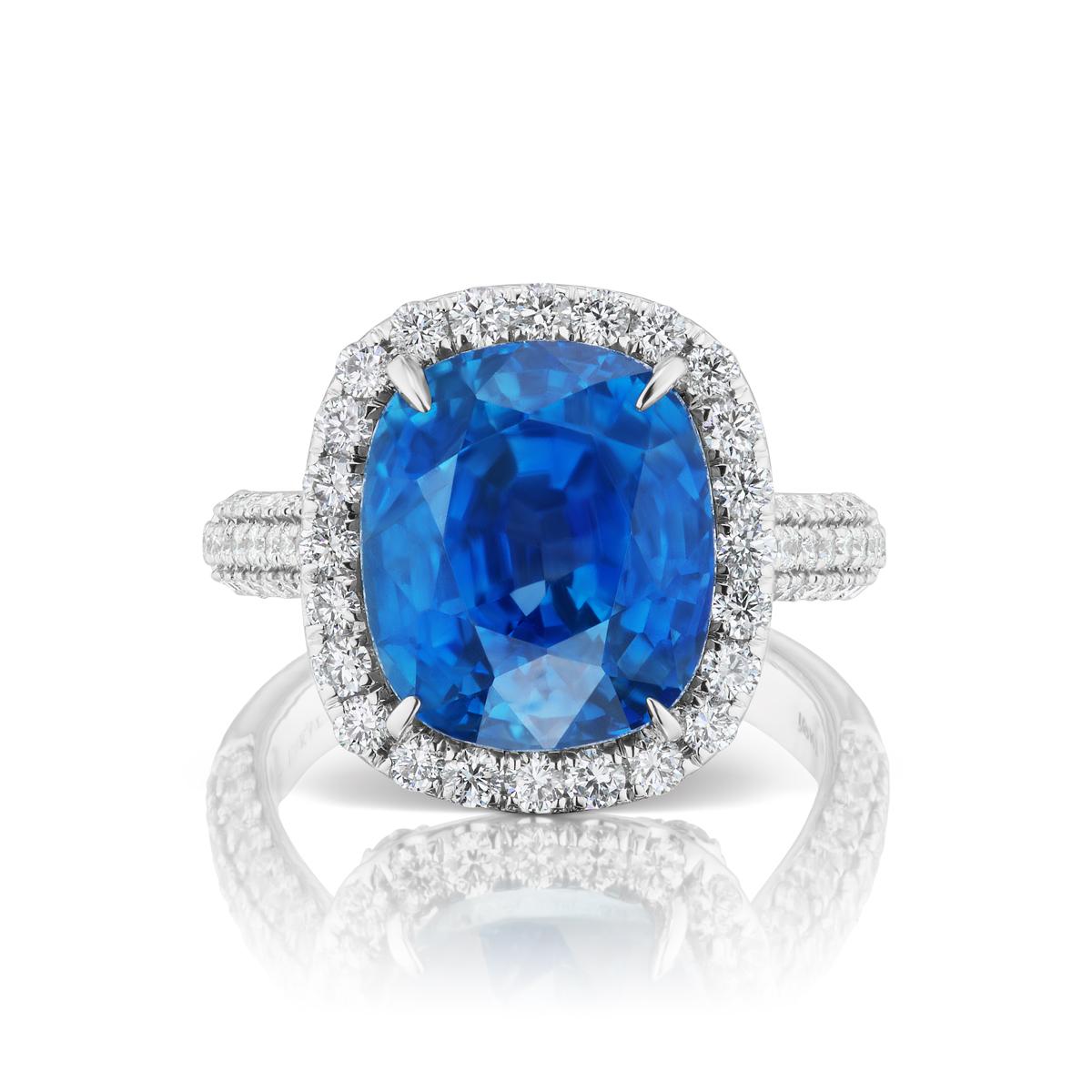 UNHEATED BURMA BLUE SAPPHIRE RING WITH DIAMONDS
An exquisite snowy diamond halo surrounds a clear blue sapphire.Sapphire is Burmese & UN-Heated with AGL and GRS Certificate.
Item:	# 03398
Setting:	18K W
Lab:	GRS & AGL
Color Weight:	12.57 ct. of