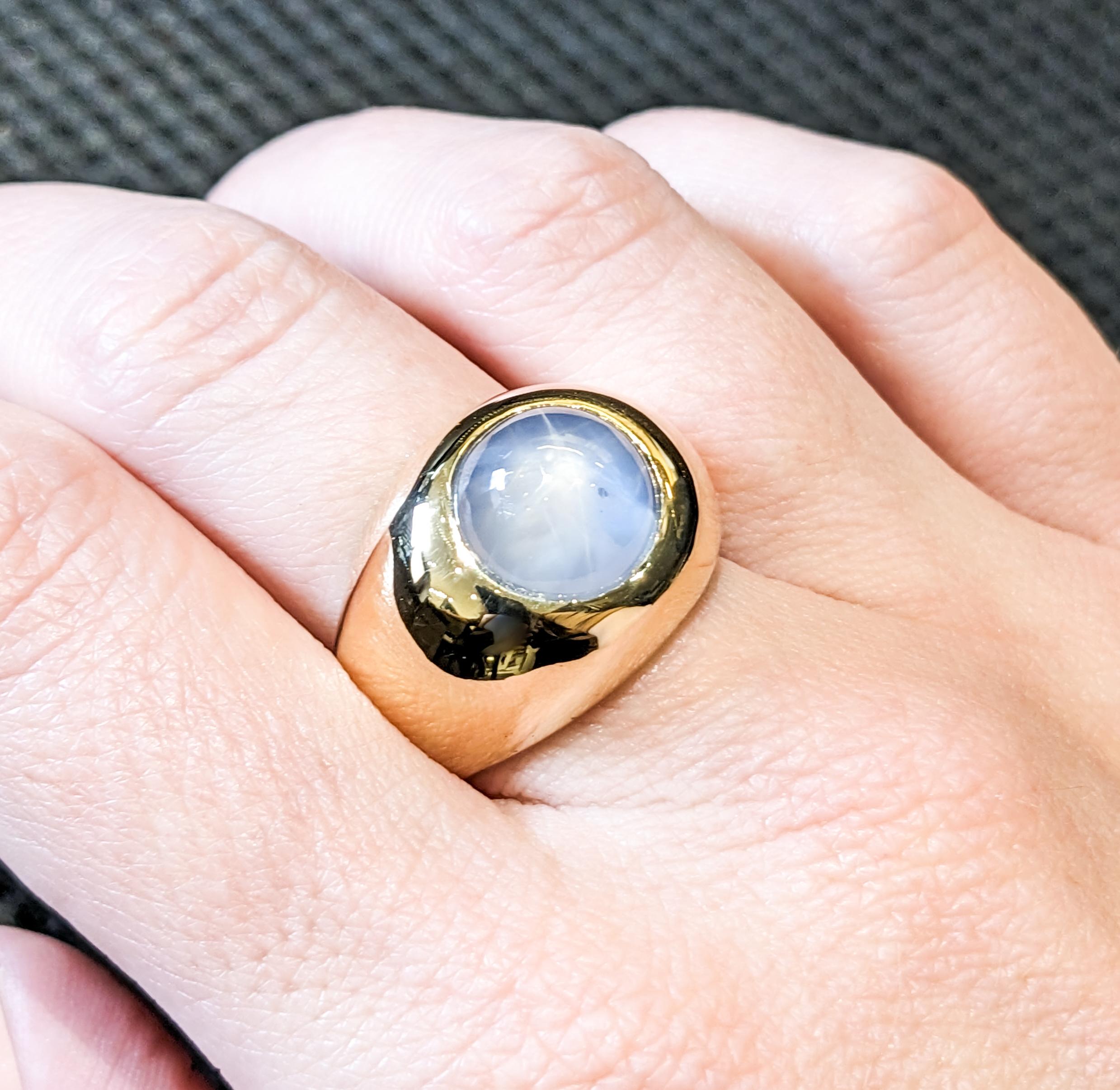 Spectacular Unheated Ceylon Star Sapphire Mens Ring

Discover timeless elegance embodied in this exceptional ring, masterfully crafted in 14k yellow gold. At its heart lies a magnificent 13.3ct cabochon Unheated Ceylon Star Sapphire, renowned for