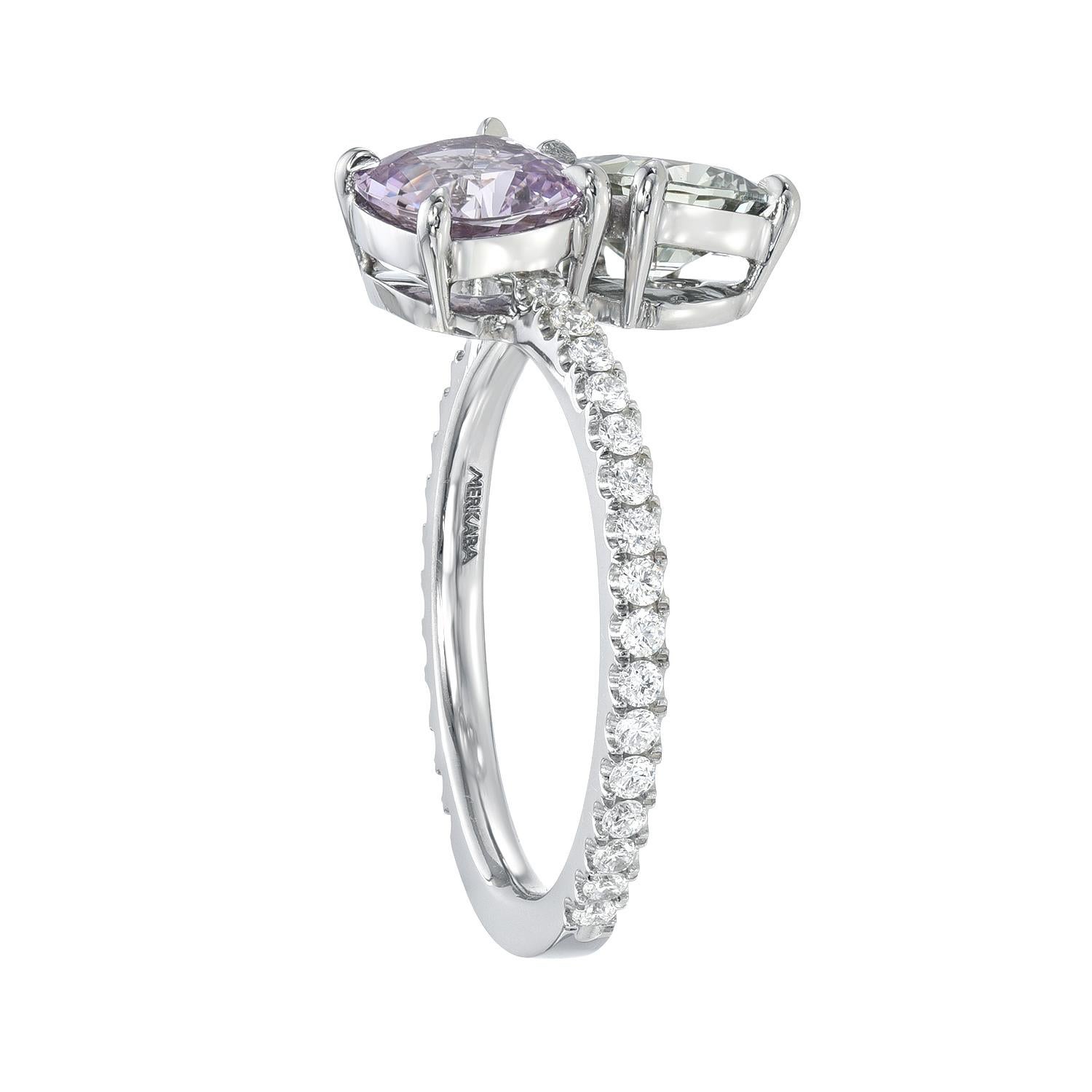 Inseparable, unheated fancy green and violet Sapphire mismatched pair, totaling 2.25 carats, are decorated with round brilliant collection diamonds, totaling 0.32 carats, in this unique platinum ring.
Size 6. Re-sizing is complimentary upon