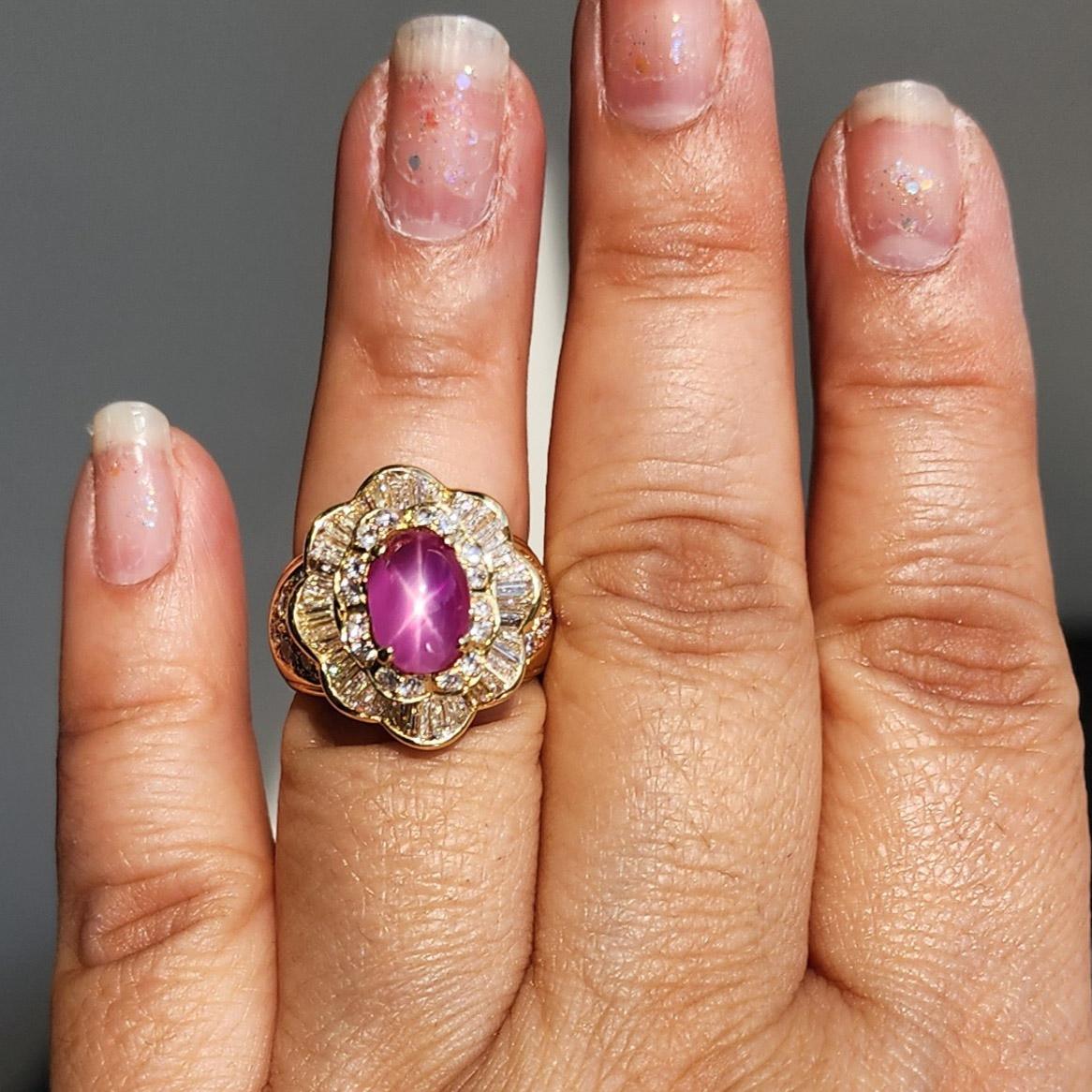 Gorgeous 3.56 ct. GIA unheated Burma purplish pink star ruby oval cabochon with 2.50 ct. good quality white diamond rounds and baguettes.  Handmade in 18k yellow gold.  Ring size 6.75.
GIA certificate included.