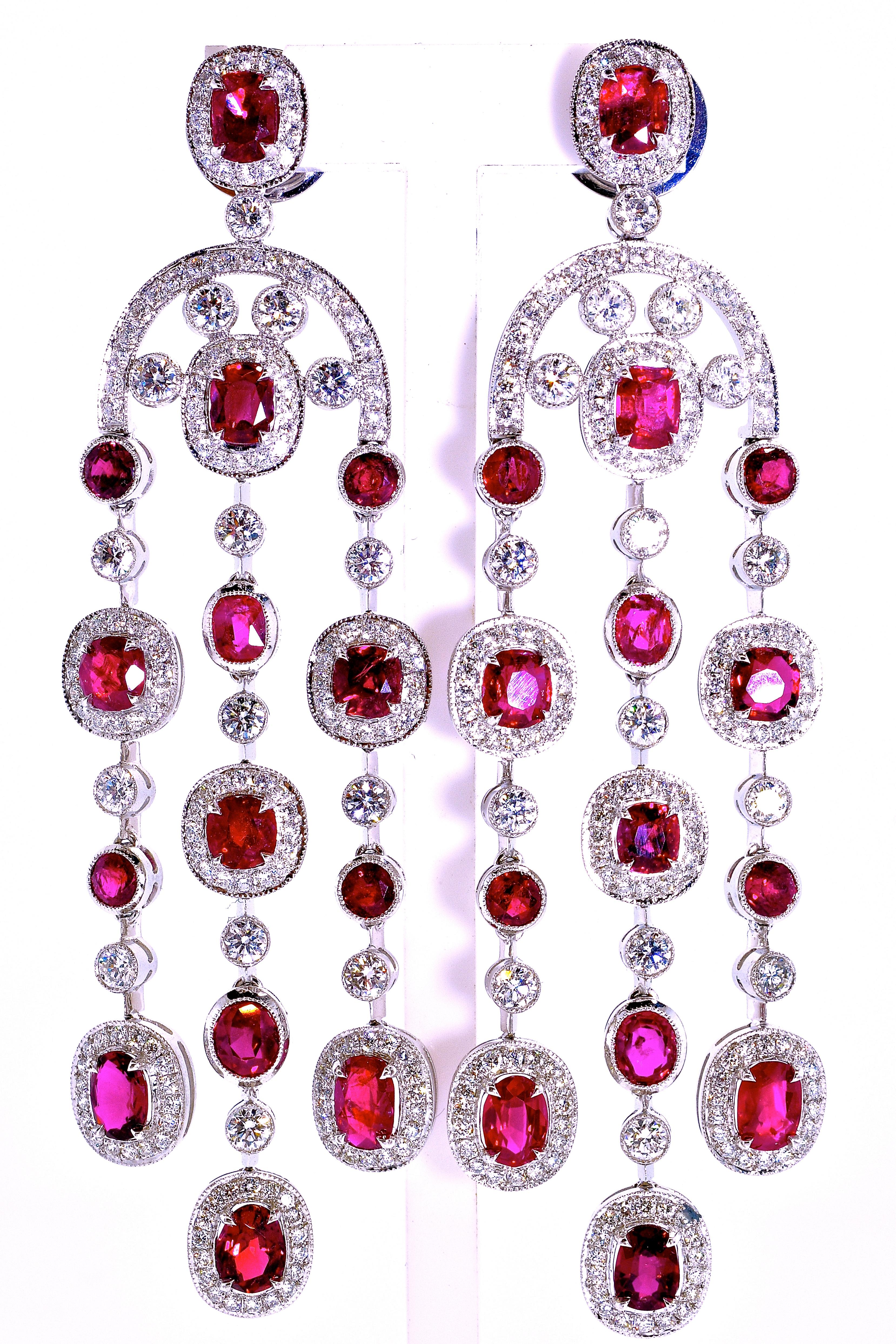 Platinum chandelier earrings possessing GIA certificates which state that the rubies are unheated and untreated. There are 10.29 cts of fine vivid red rubies in 28 round well cut stones.  In addition these earrings possess 330 well cut and well