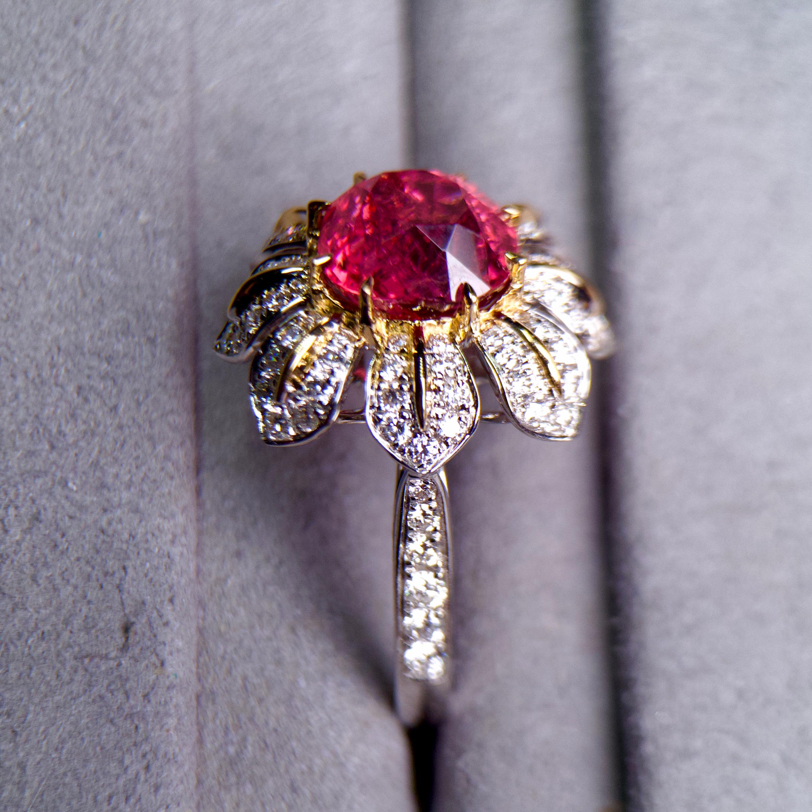 A 3.32ct Unheated Intense Red Color Spinel and Diamond Ring in 18k Gold 

Main Spinel Weight is 3.32ct, The color of the Spinel is Intense Red and in Known in the trade as “Jedi Spinel”. 

Total Natural Diamond Weight is 0.704ct, The Color of the