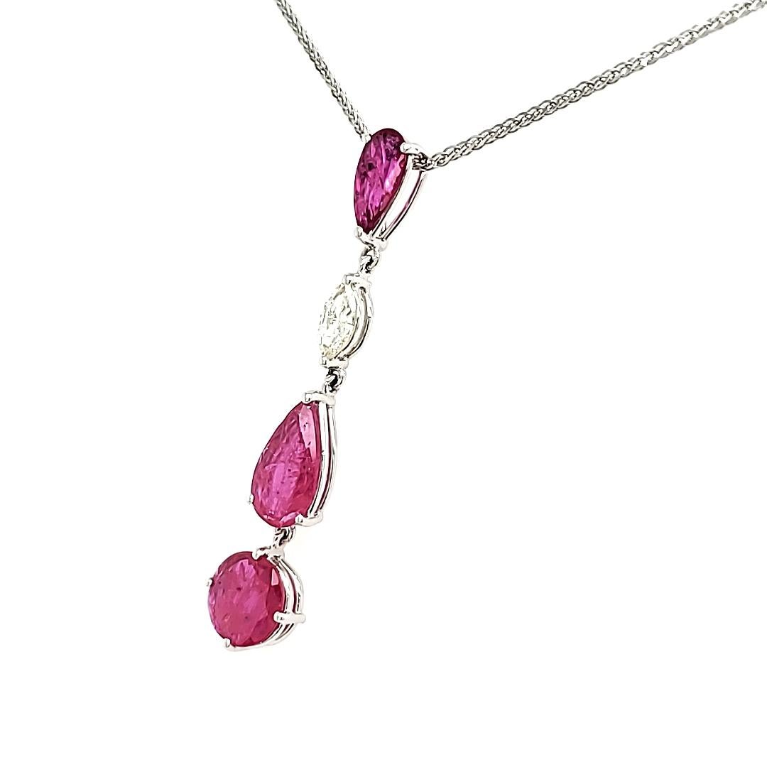 Contemporary Unheated Mozambique Round and Pear Ruby Cts 2.21 and Marquise Diamond Pendant  For Sale
