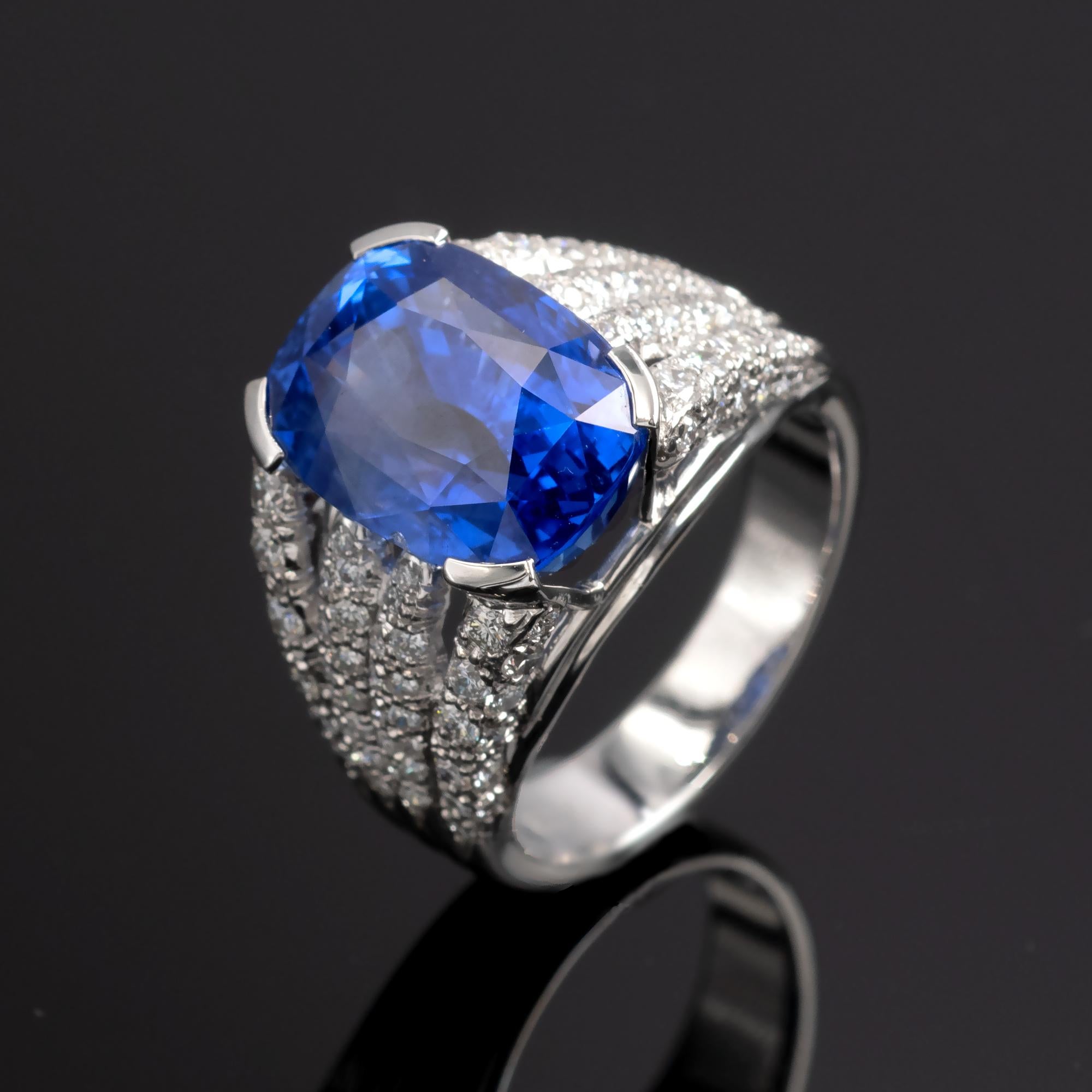 A lively intense blue sapphire on a unique 18 Kt white gold and diamond ring. 
The sapphire comes with a GRS gemstone report stating that it is a natural unheated Sri Lankan sapphire.

 
