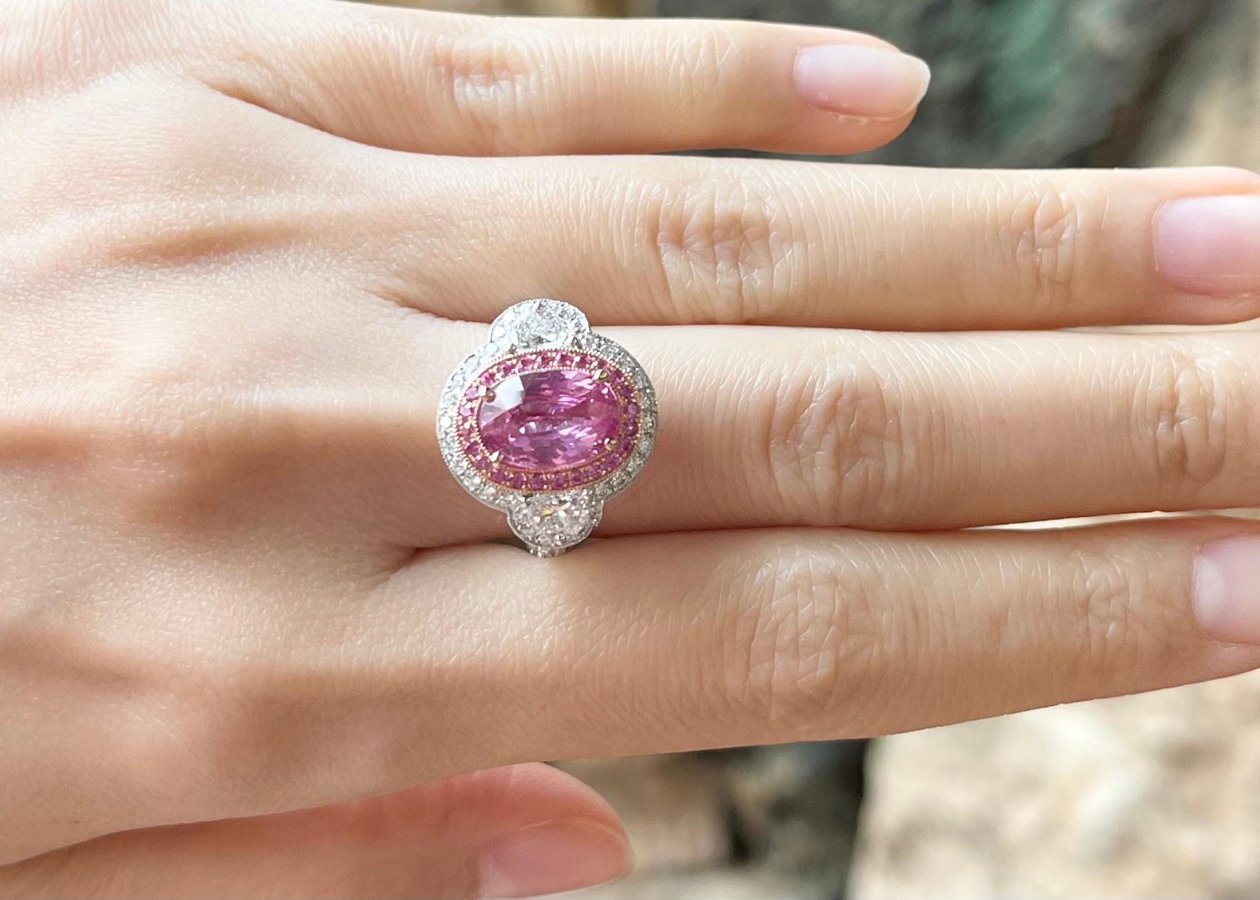 Unheated Pink Sapphire 3.18 carats, Pink Sapphire 0.27 carat and Diamond 1.94 carats Ring set in 18K White /Rose Gold Settings


Width:  1.9 cm 
Length: 1.7 cm
Ring Size: 52
Weight: 9.37 grams

