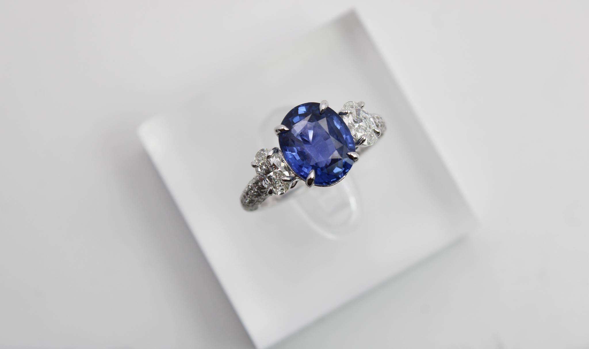 This striking ring features a natural 2.05 carat sapphire, certified by GRS as vivid blue in color, GRS-type 