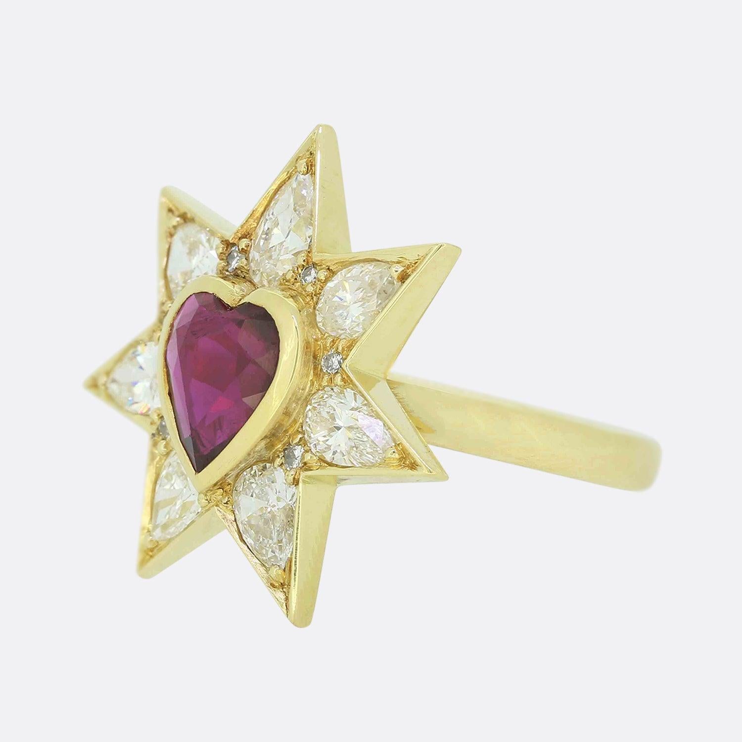 Here we have a stunning ruby and diamond ring. The head of this piece has been expertly crafted from 18ct yellow gold into a seven pointed star with each point playing host to a sizeable pear cut diamond and a smaller round brilliant stone nestled