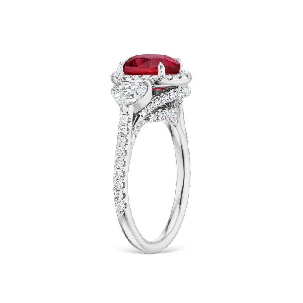 RUBY RING WITH DIAMONDS
A beautiful ruby ring with bright diamond heart shape and micropave along the gallery makes this unheated Mozambique ruby shine.

 Item:	# 03042
Setting:	18K W
Lab:	GRS
Color Weight:	3.04 ct. of Ruby
Diamond Weight:	1.48 ct.