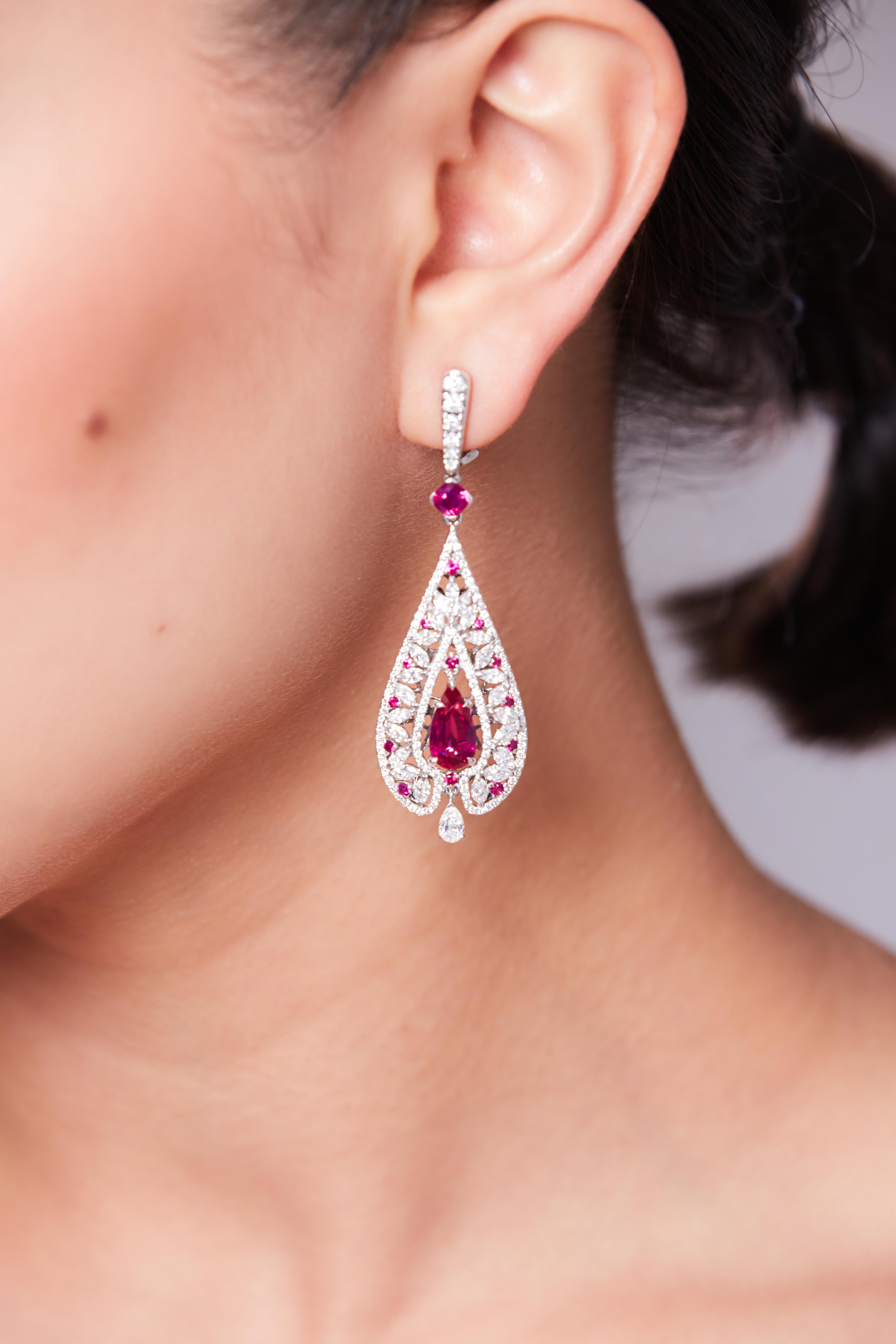 Royal Ruby Collection 

Natural Drop Ruby and Diamond  Earrings 
•• Earrings in 18K white gold. 
• Unheated rubies- 2 pc in drop cut - total carat weight 4.61. 
• Unheated rubies- 2 pc in square cushion cut - total carat weight 1.16.
• long each. 
•