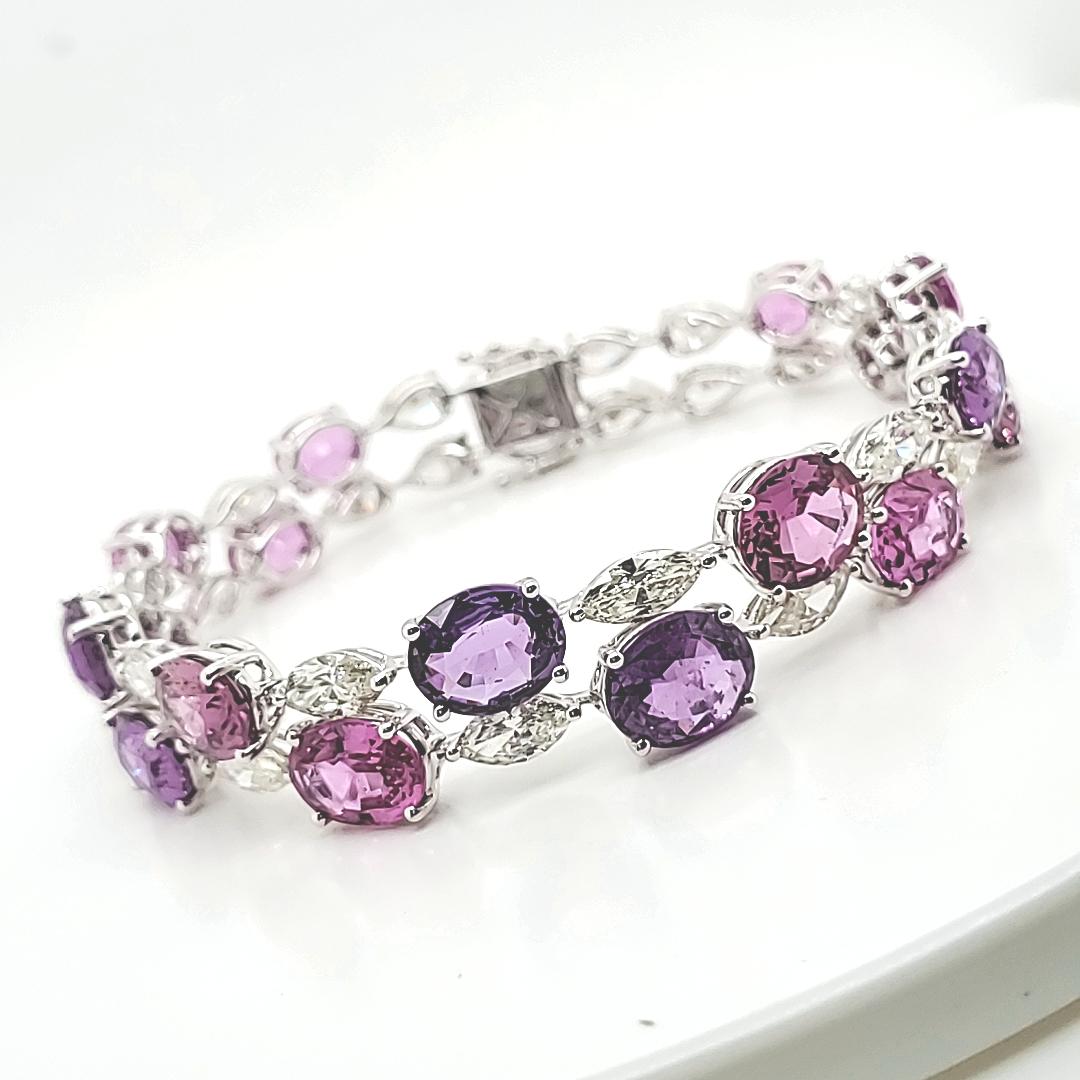 Pink and Purple Sapphire Bracelet with Marquise and Pear diamonds    

A bevy of pink and purple Sapphires adorn this bracelet of scintillating stones, interspersed with many Pearshape and Marquise diamonds. 

Every stone sparkles with brilliance