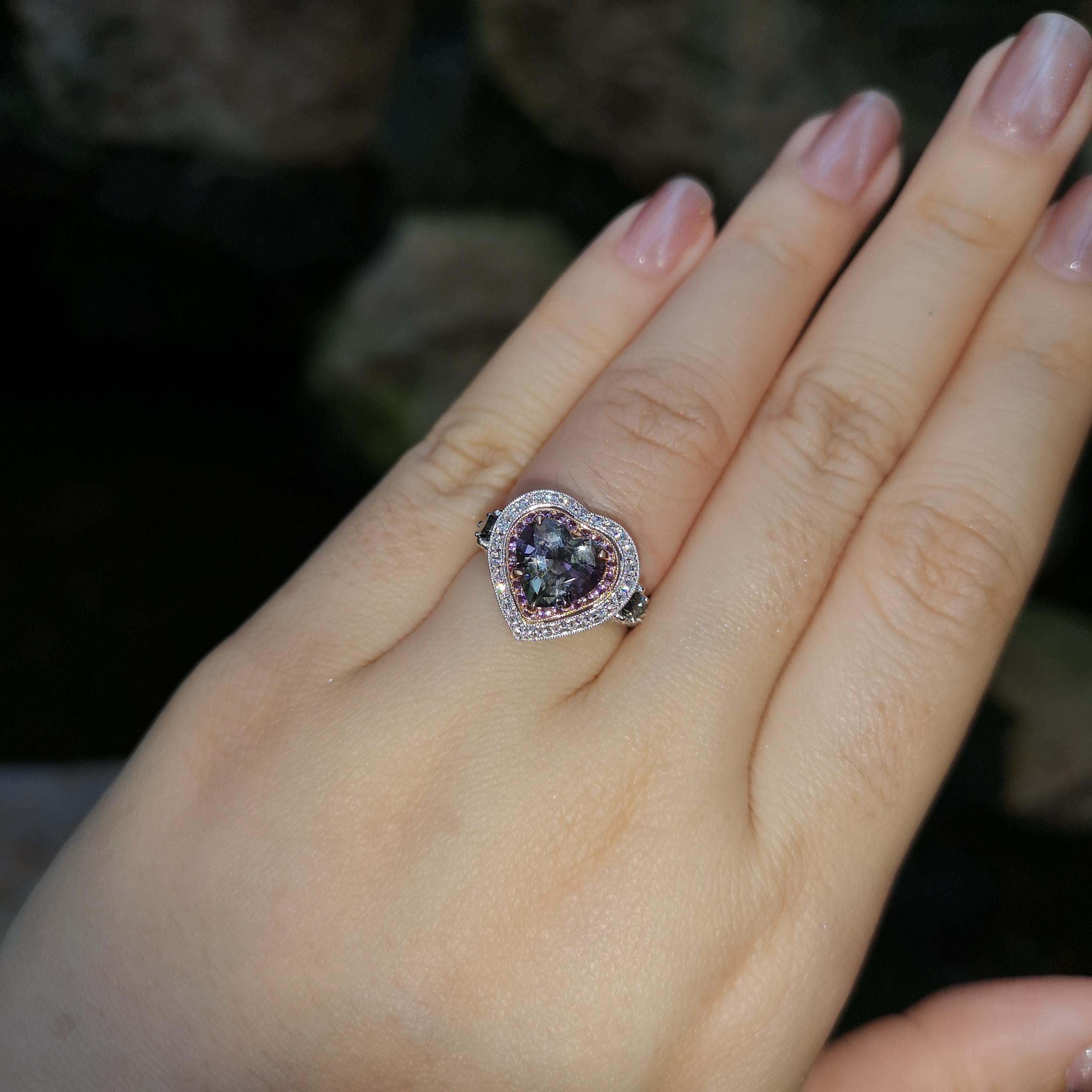 Unheated Tanzanite 2.30 carats, Purple Sapphire 0.25 carat, Green Sapphire 0.66 carat and Diamond 0.63 carat Ring set in 18K White Gold Settings

Width:  1.5 cm 
Length: 1.6 cm
Ring Size: 53
Total Weight: 7.50 grams

