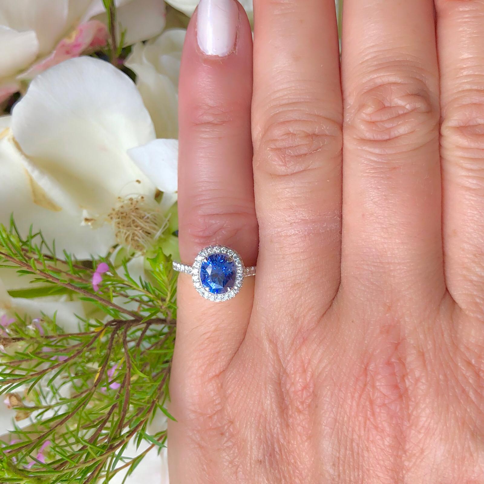 This beautiful 18k white gold, no-heat sapphire ring will charm with it's subtle color change from violet to blue! Well saturated with full, rich color, the 2.36-cts. oval sapphire is set within a halo and micro-set shoulders of 72 round