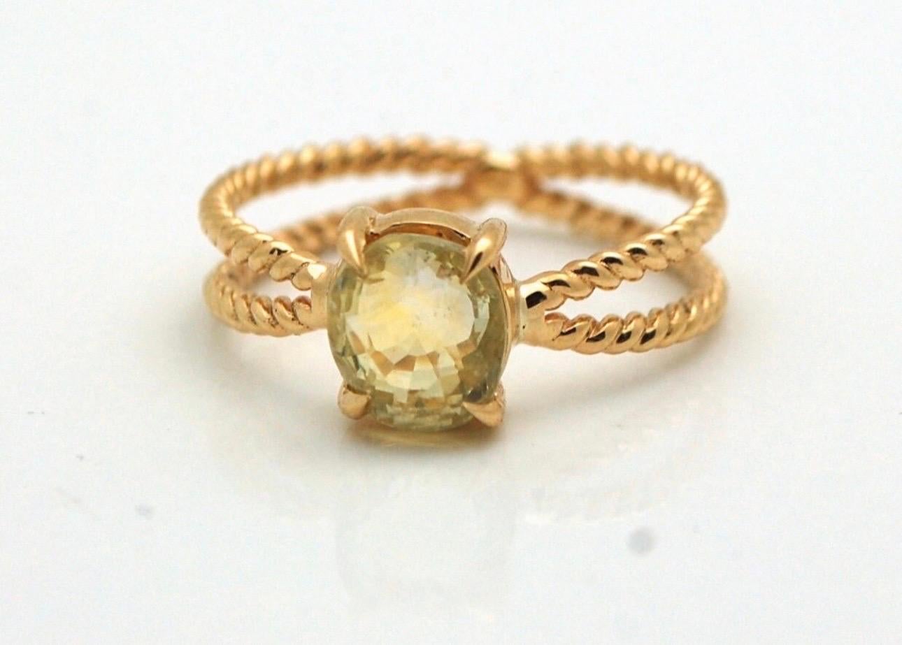 Incredible spiritual ring, made with unheated yellow sapphire totalling 2 carats in 18kt yellow gold. This ring is completely open from under the stone and a lot of people believe that if the yellow sapphire tiuches the skin of the person it gives