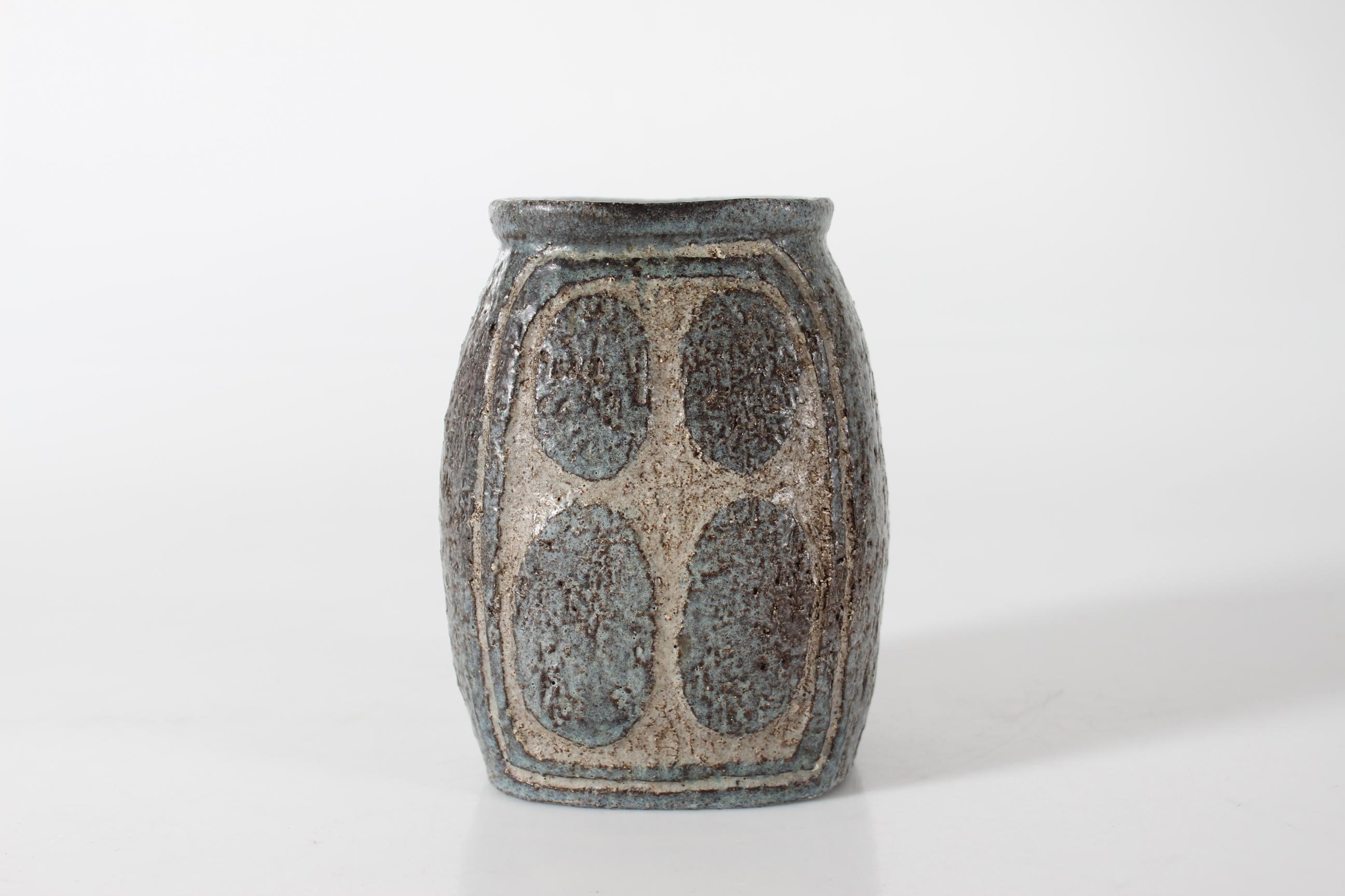 Rustic mid-century Danish vase by Fridtjof Sejersen for Sejer Studio Ceramic.
It´s made in the 1960's at his own studio workshop in Nr. Aaby on the Danish island Funen. Fridtjof Sejersen ran the ceramic work-shop from 1941 to 1978.

The slightly