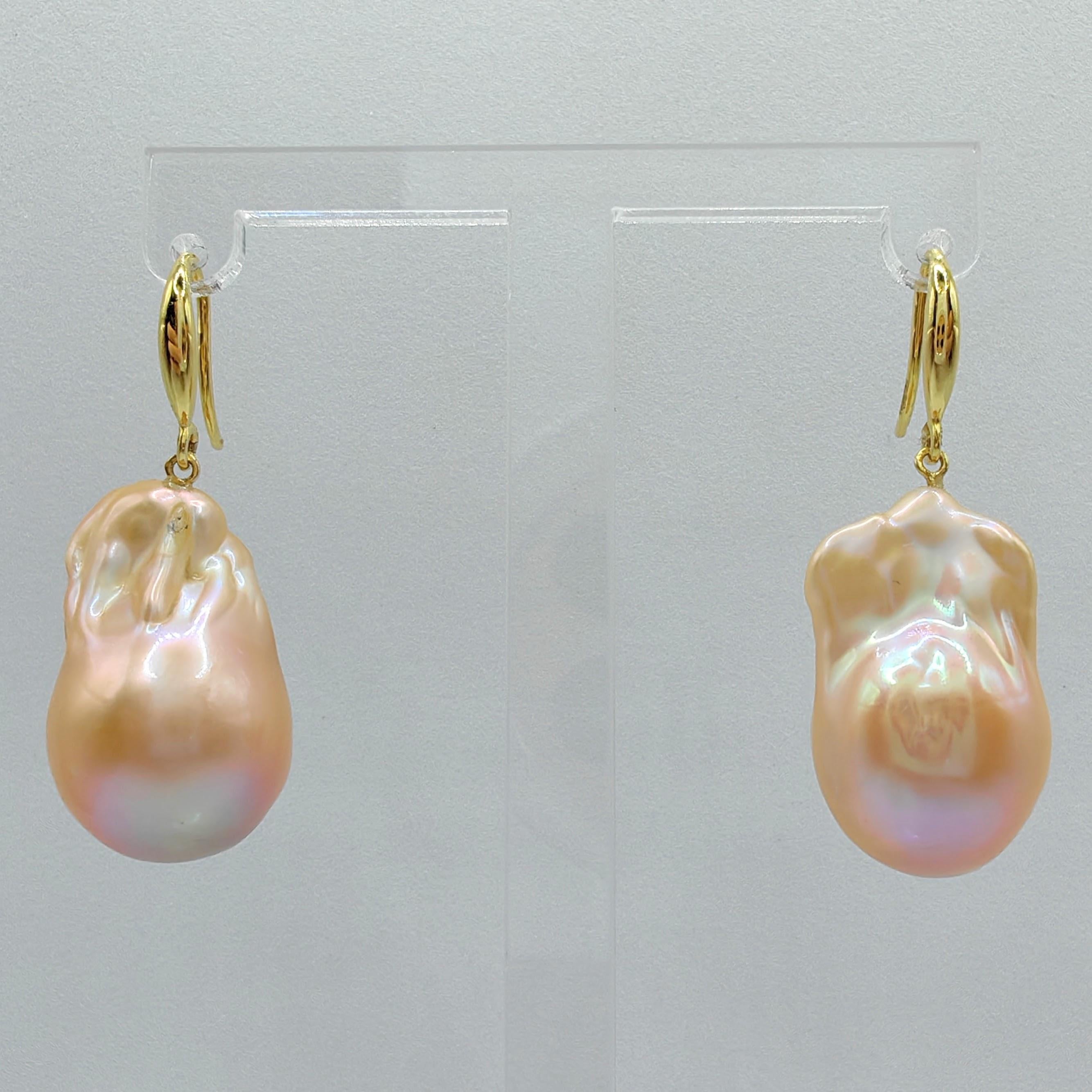 Indulge in the captivating allure of our Unicorn Hue Pink Baroque Pearl Drop Earrings, meticulously crafted to captivate and inspire. These remarkable earrings feature two stunning Freshwater Cultured Baroque Pearls, boasting an enchanting unicorn