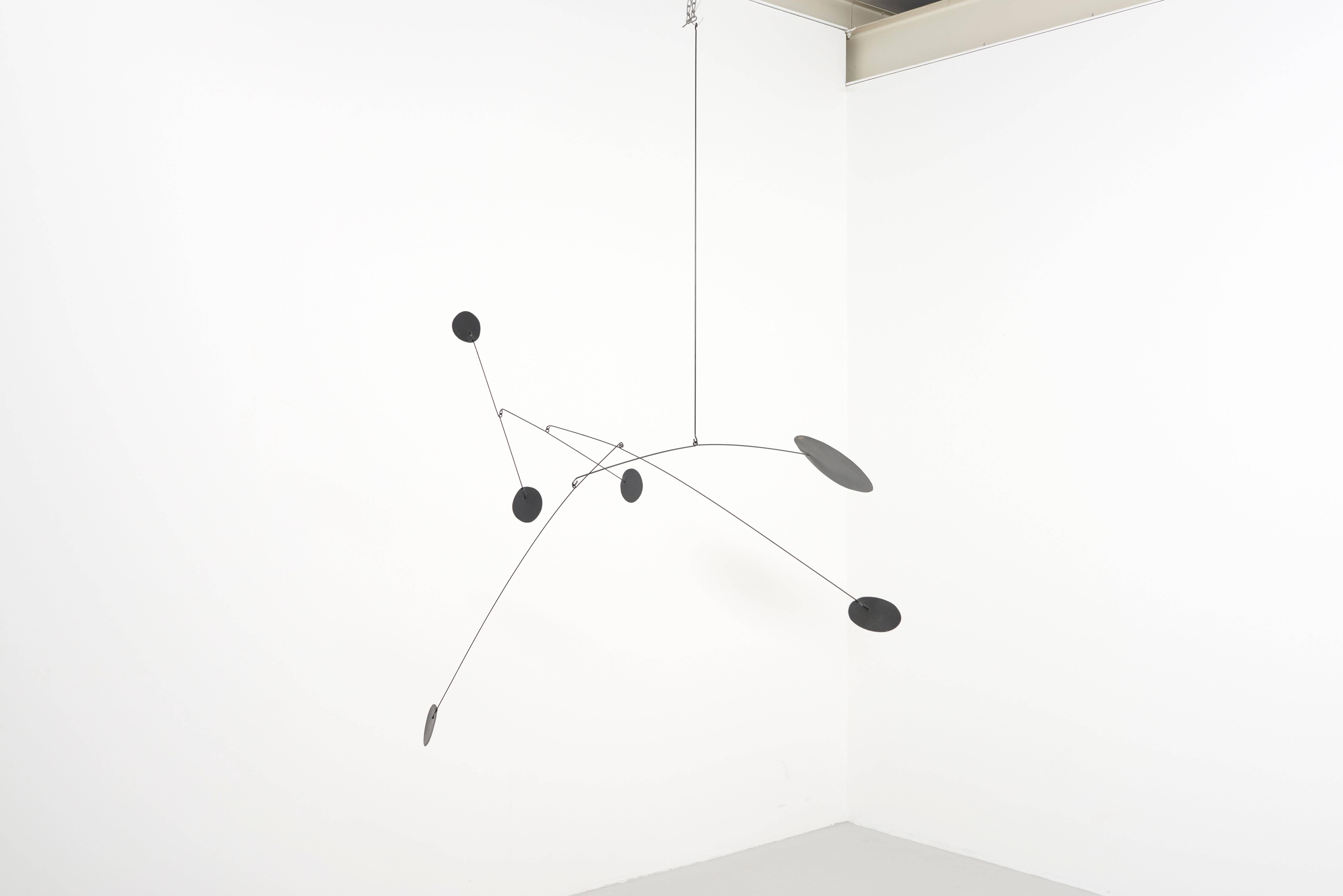 Mobile designed and made by Derick Pobell, Germany. 
Five parts, painted metal in black, arranged with metal bars.
One kinetic sculpture in motion is a feast for the eyes, aesthetically beautiful in a large architectural living space.
Always one