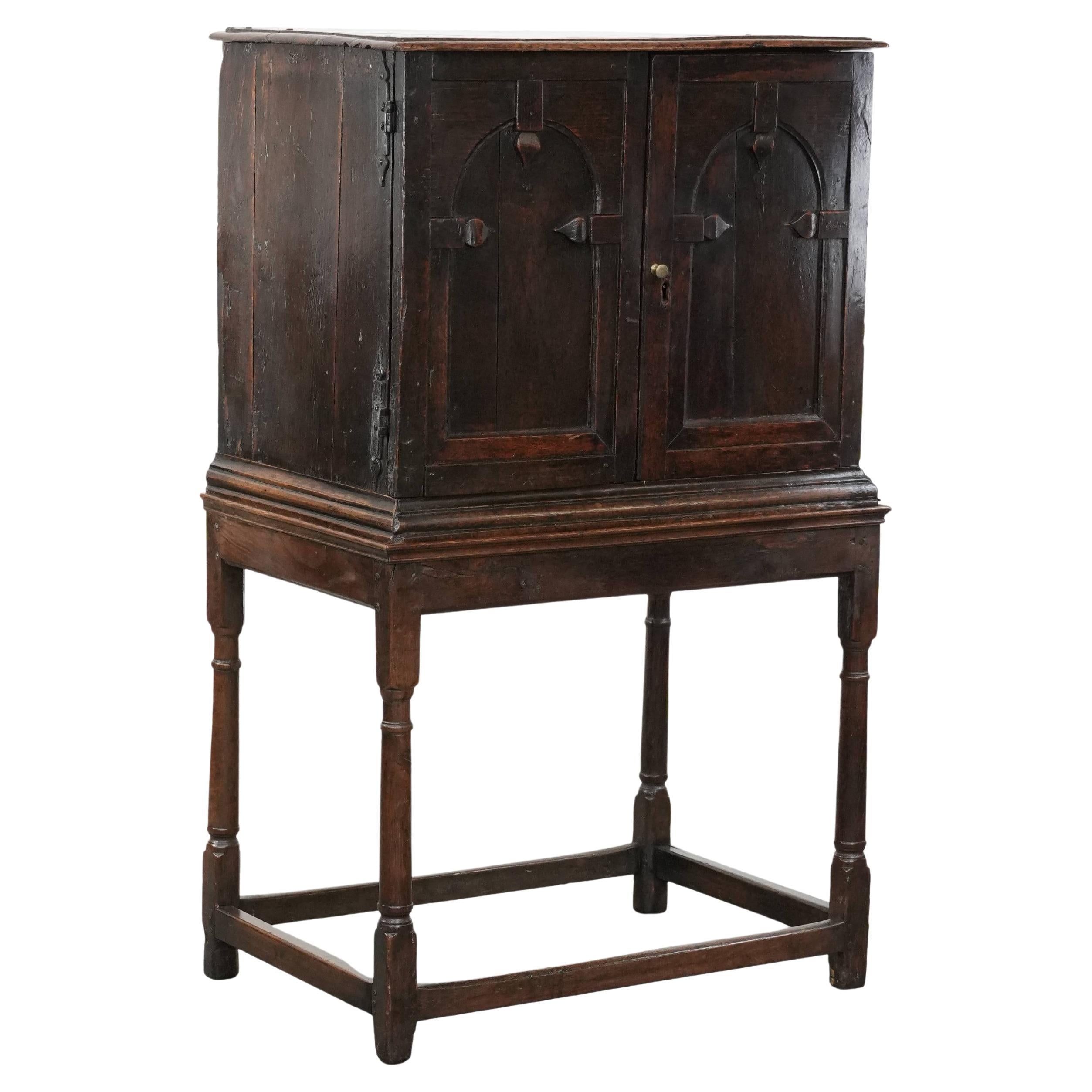 Unique antique English cabinet on stand made of oak from the 17th century For Sale