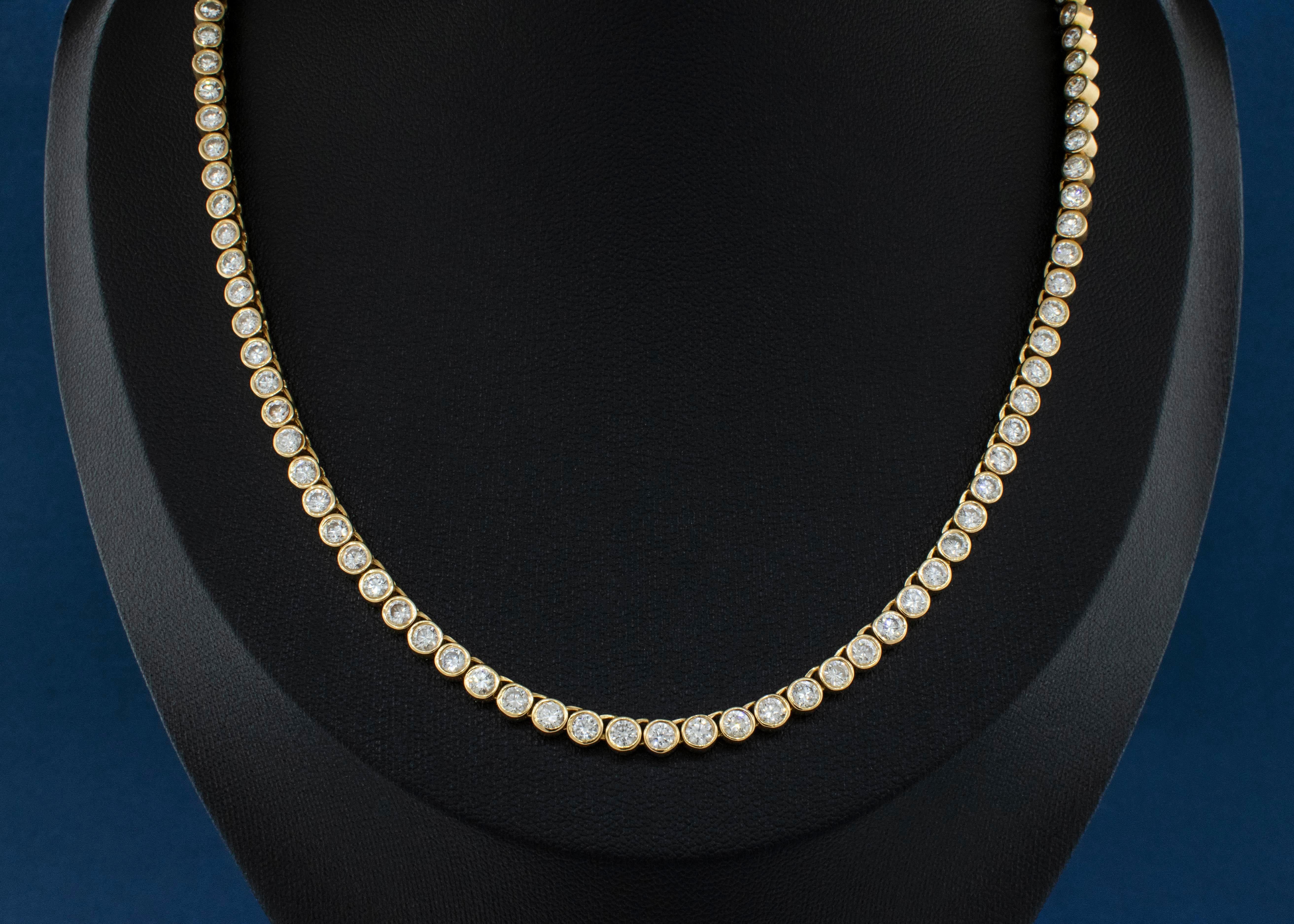 Uniform Object 18K Yellow Gold Bezel Set Diamond Necklace
Metal: 18 Karat Yellow Gold
Stones: Diamonds weigh approximately 10 carats total.
Clarity: SI2 
Color G-H
Weight: 53.75 Grams
Brand: Uniform Object
130 Diamonds
94 bezel set and 36 prong set