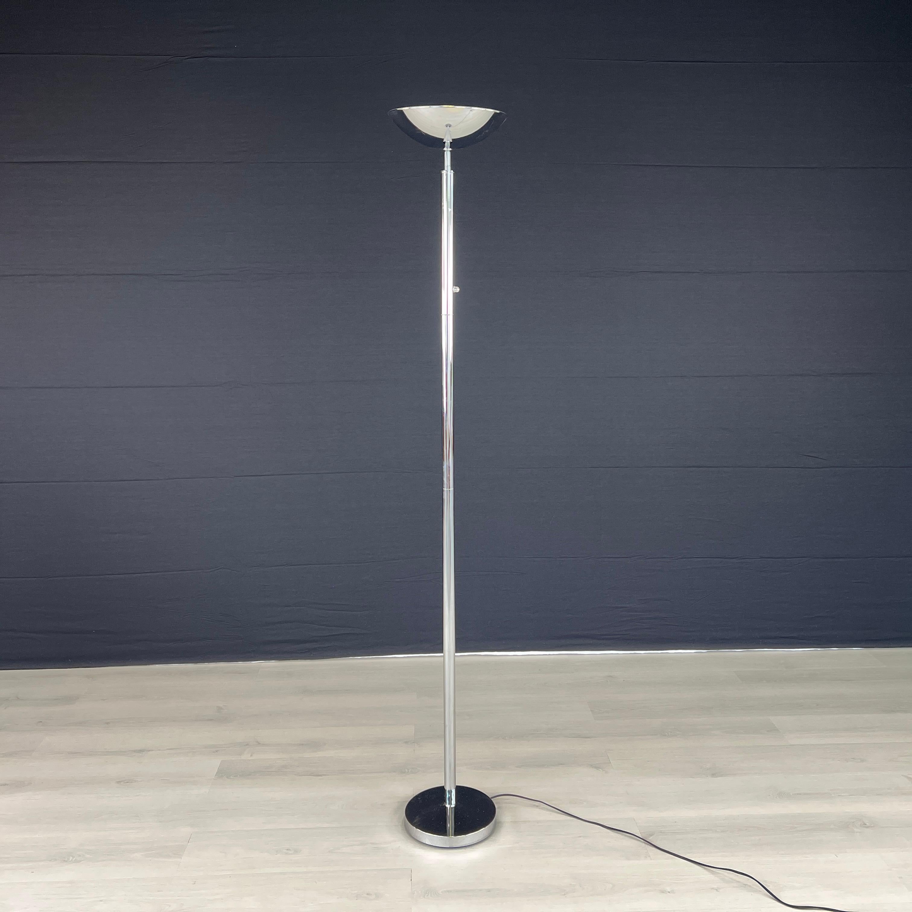 Dimensions: H 72” x W (base) 10”

Modern design chromed floor lamp by Unilux. This stylish lamp fits in any room and provides effective lighting. 
Please see our other listings for ideas and matching pieces.

Condition: Condition consistent with