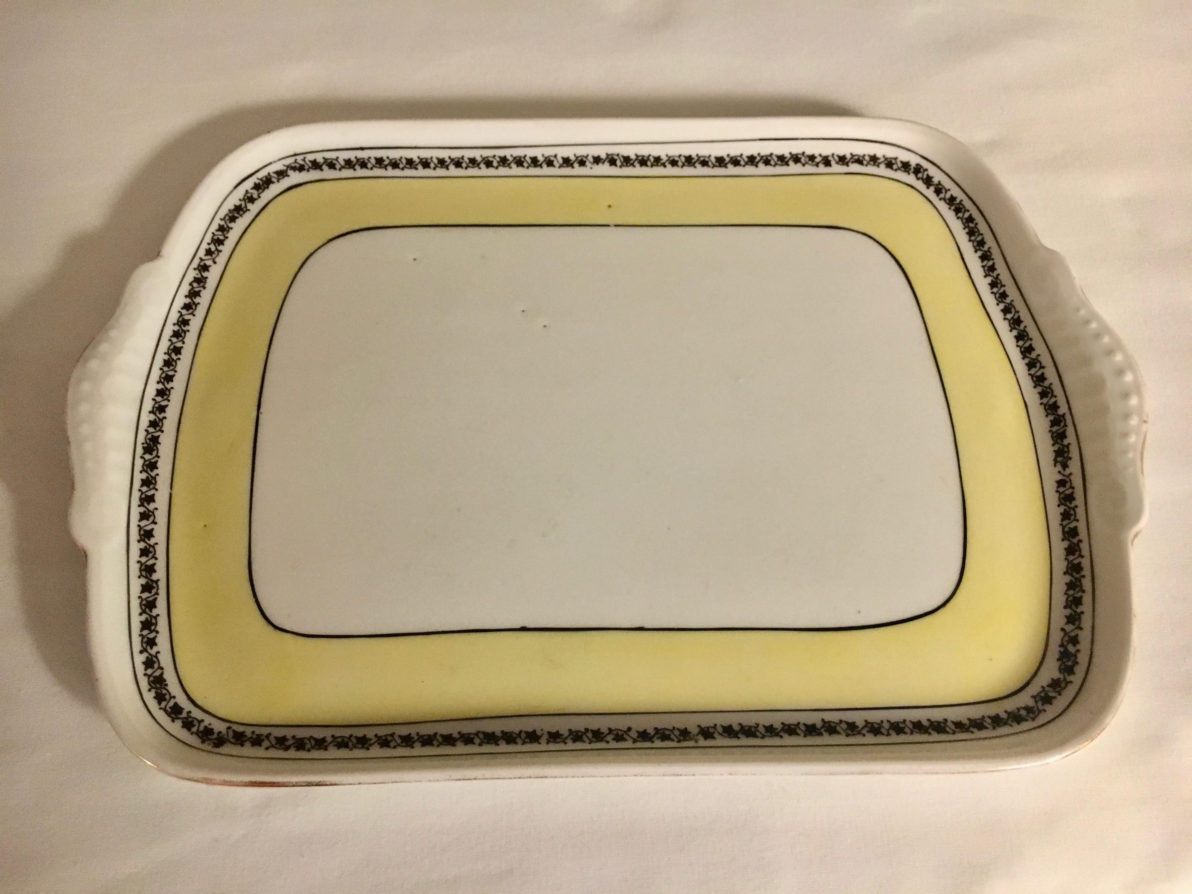 Union Bavaria porcelain tray and candlesticks - a lovely pair. Small tray and pair of candlesticks with beautiful yellow pattern rim - works with contemporary and traditional settings.

Measures: Candlesticks 3