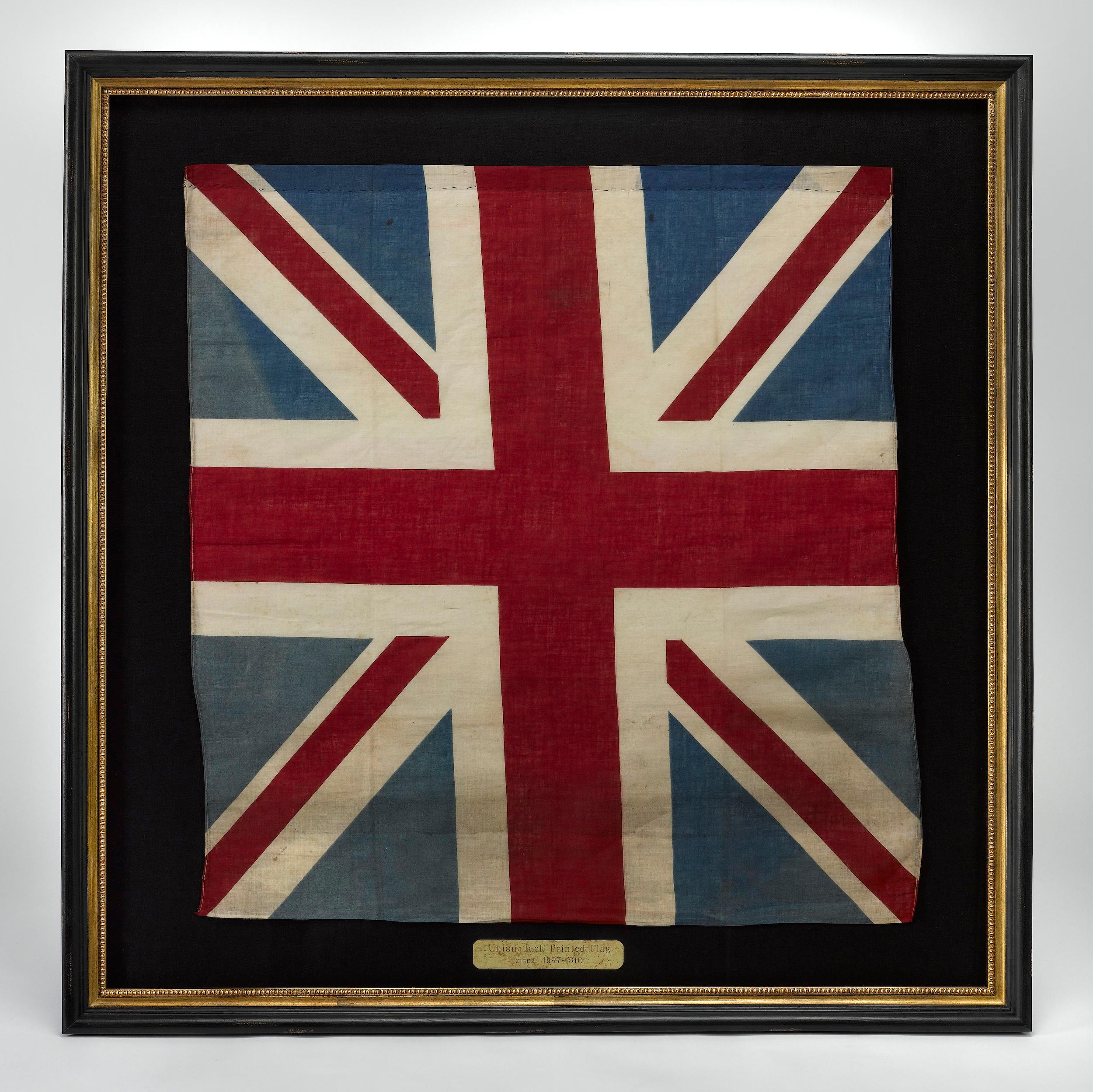 Presented is a printed Union Jack parade flag. The flag dates to the turn of the century, from 1897- 1910. The flag is printed on cotton and is hemmed at top and bottom with white machine-sewn thread. 

This flag is a combination of the flags of