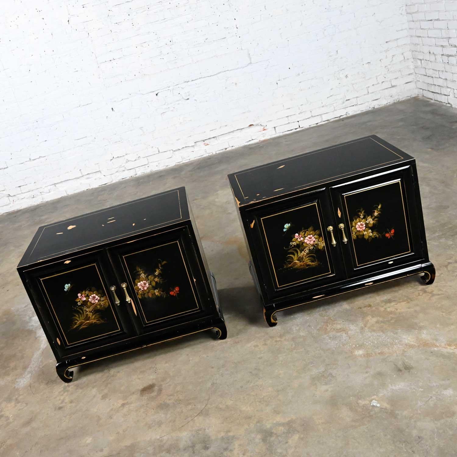 Gorgeous Union National Chinoiserie chow leg Ming style pair of nightstands black with floral design signed Dimas, distressed patina painted finish, and teardrop brass pulls. Beautiful condition, keeping in mind that these are vintage and not new so
