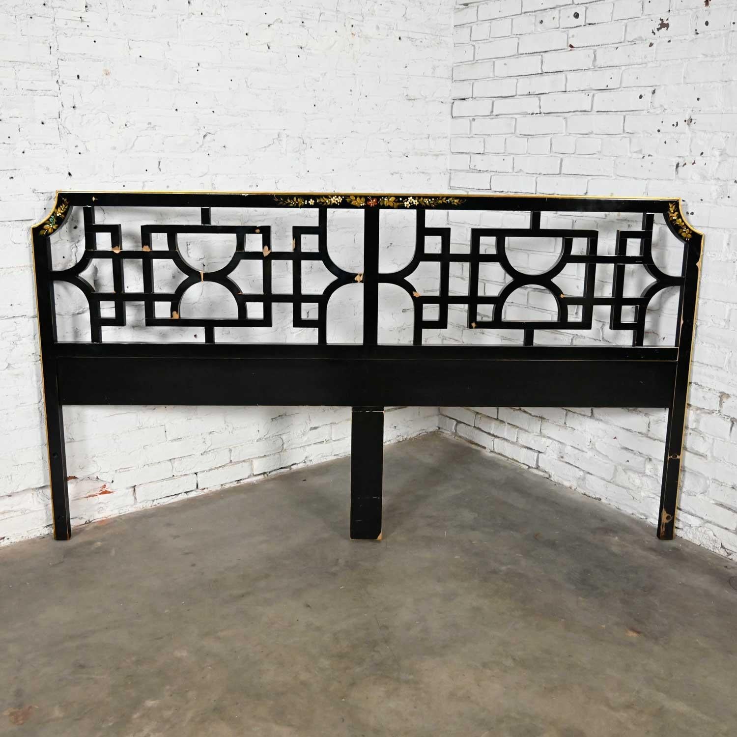 Phenomenal vintage Union National chinoiserie carved fretwork style king-sized headboard black painted with tole painted floral and butterflies design & distressed patina finish signed Dimas. Beautiful condition, keeping in mind that this is vintage