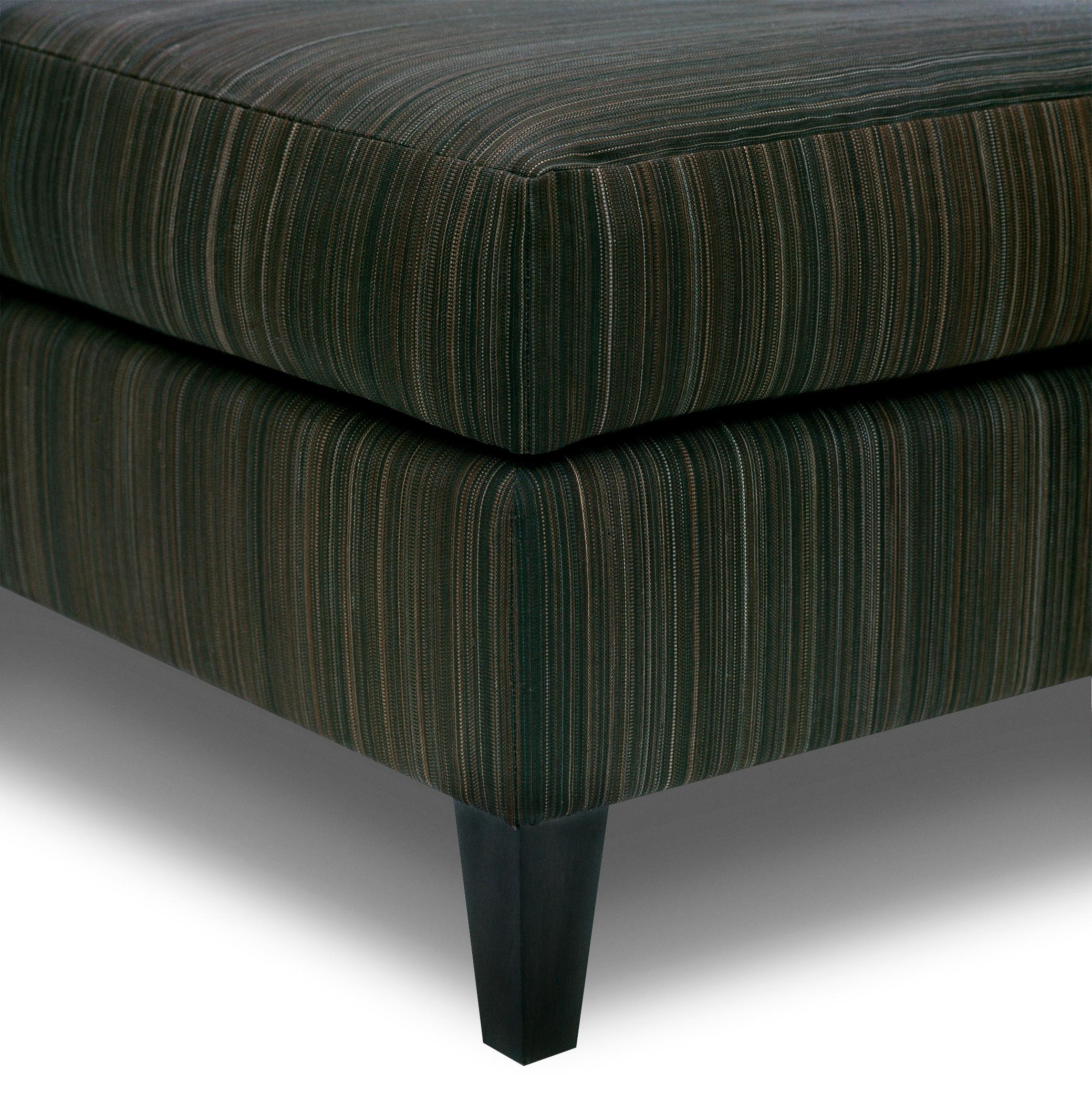 The union ottoman is tightly upholstered with an attached top cushion. Tapered front legs and squared back legs are made of blackened hardwood.

This union ottoman is a made to order item and hand crafted in the US. 
Customer's own material is