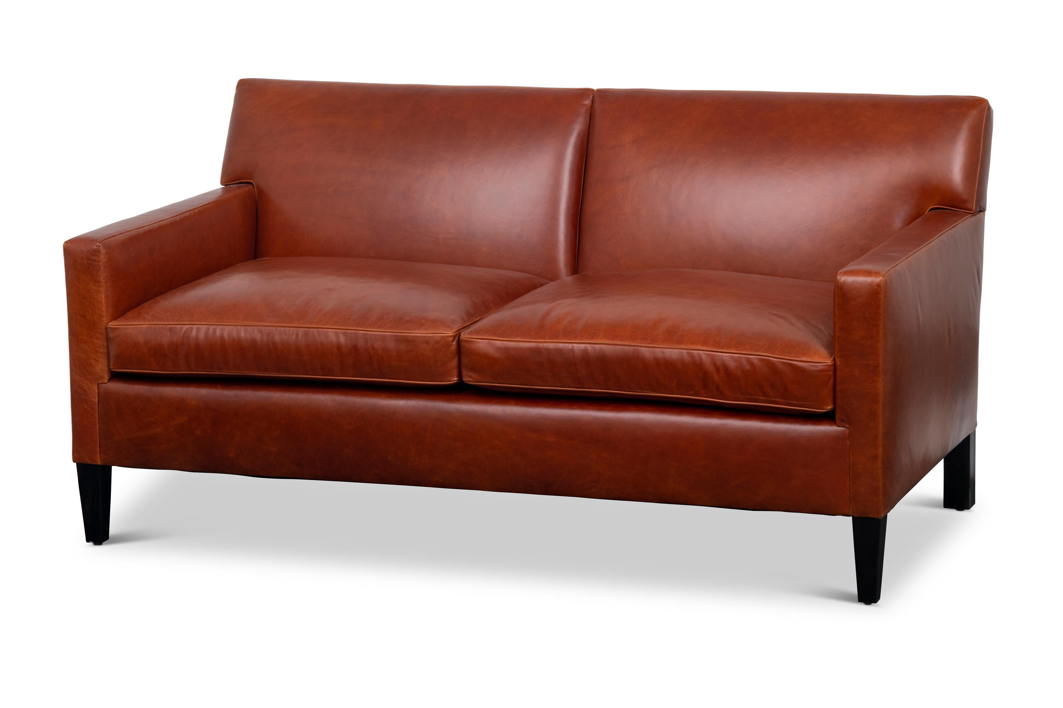 The Union sofa has a tight upholstered back with two loose seat cushions. Tapered front legs and squared back legs are made of blackened hardwood.

The Union sofa is a made to order item and hand crafted in the USA. 
Customer's own material is