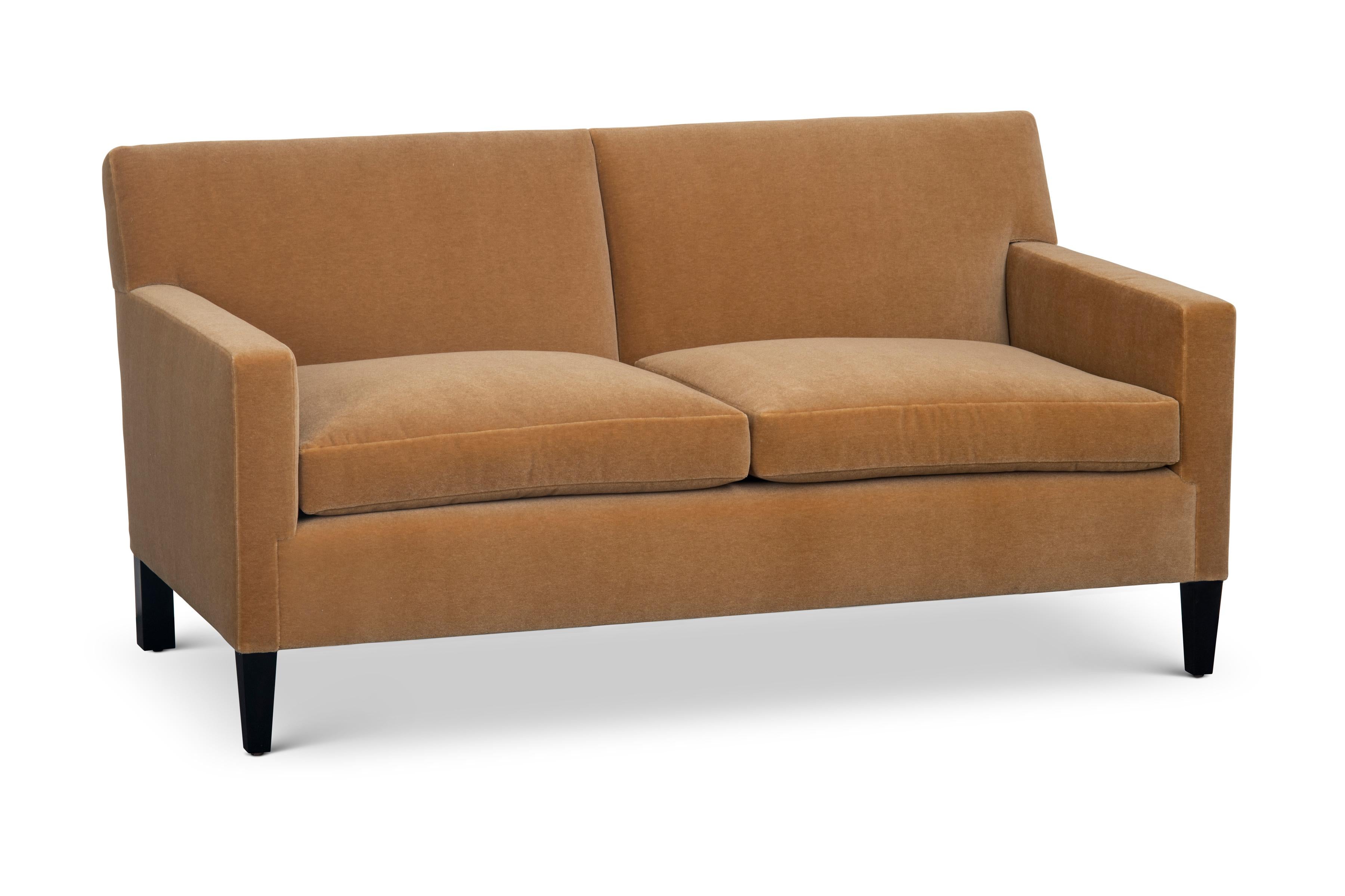 The Union sofa has a tight upholstered back with two loose seat cushions. Tapered front legs and squared back legs are made of blackened hardwood.

The Union Sofa is a made to order item and hand crafted in the USA. 
Customer's own material is