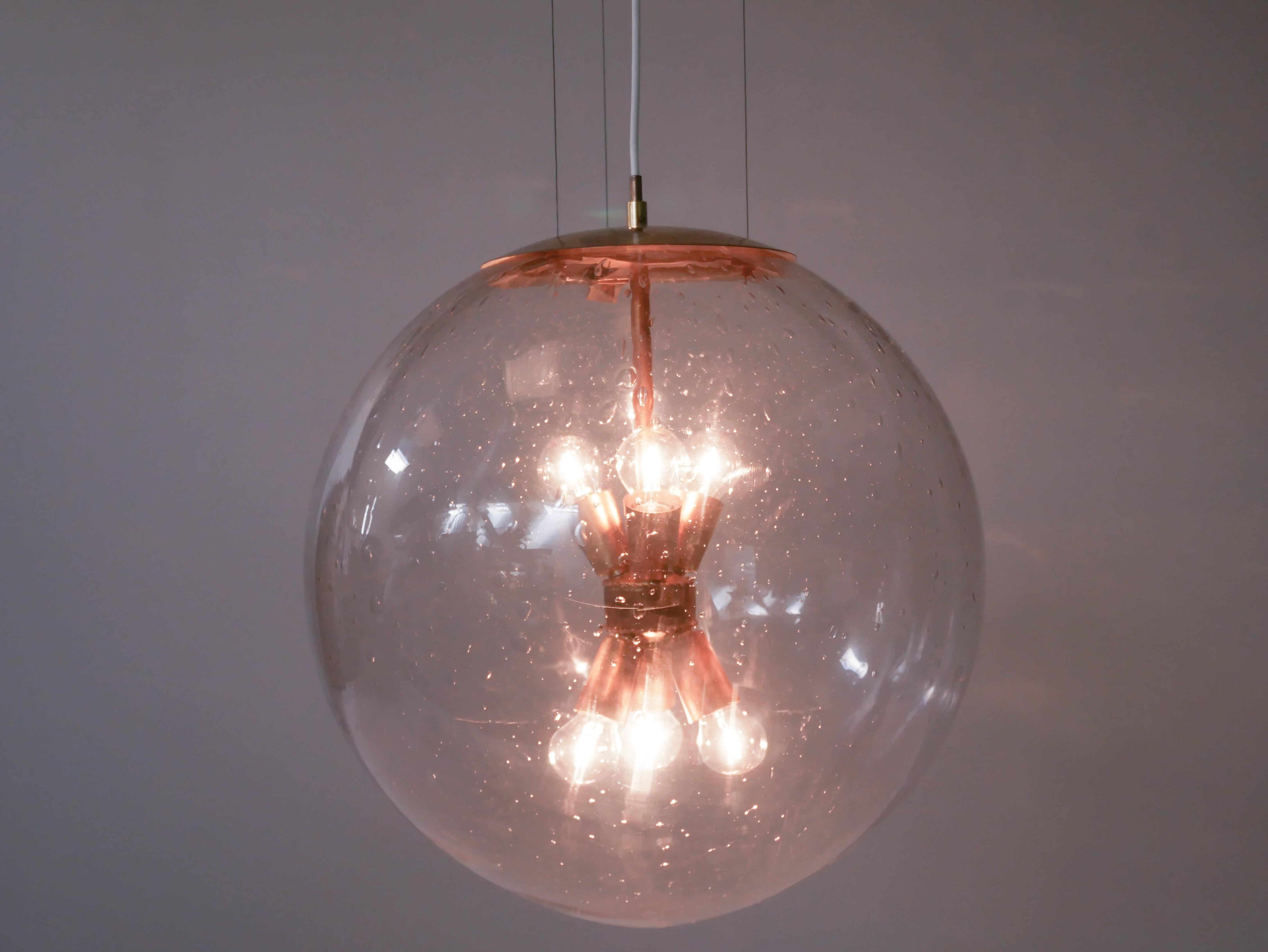 Hans-Agne Jakobsson wire suspended lamp.
This model was designed and manufactured specially for the Swedish pharmaceutical company Leo in Helsingborg in the early 1960s.
There was only five made of these and they hanged in a group in their main