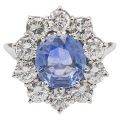 Unique 14k white gold ring with an untreated natural sapphire and diamonds.