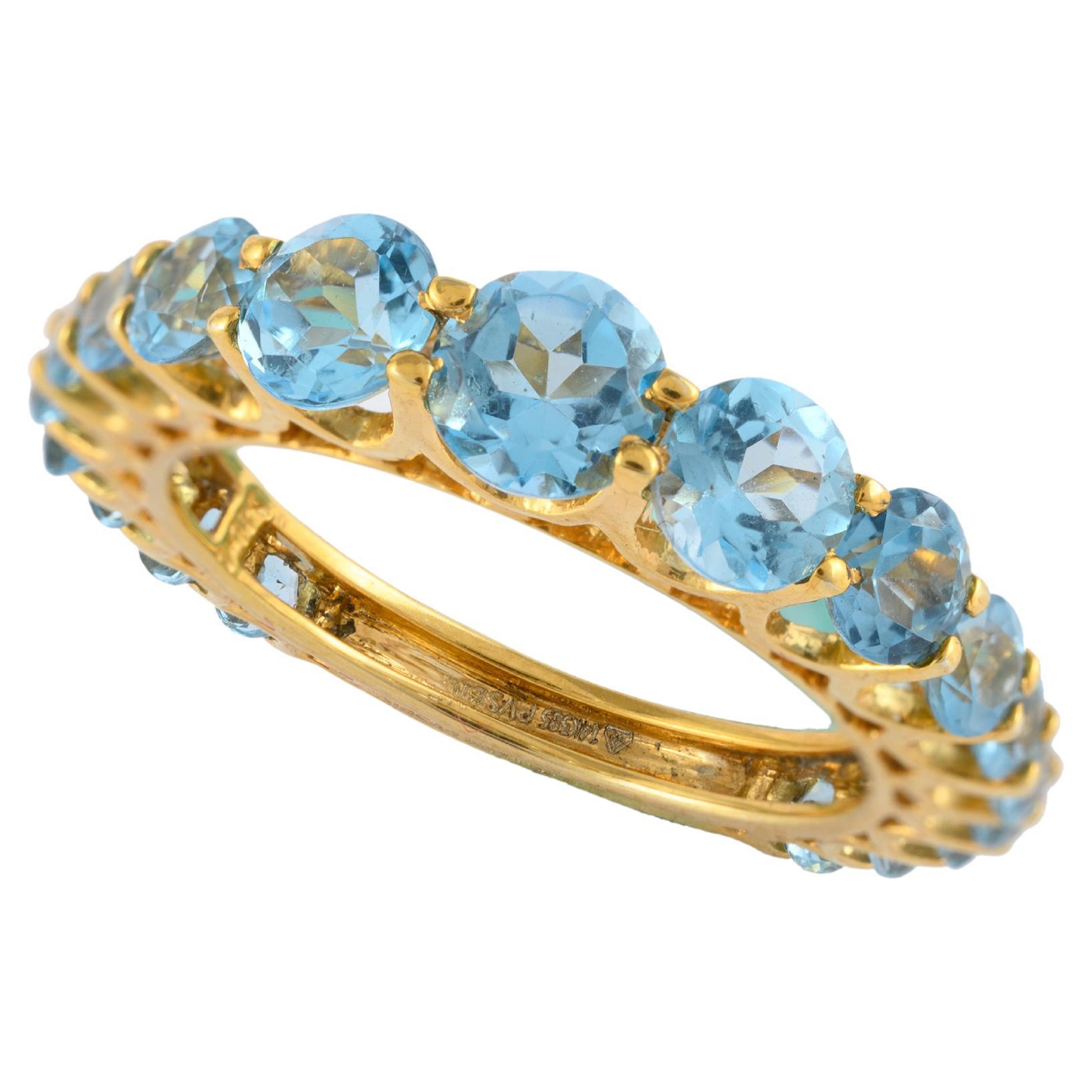 For Sale:  Unique 14k Yellow Gold 3.09 Carat Blue Topaz Half Eternity Band Ring