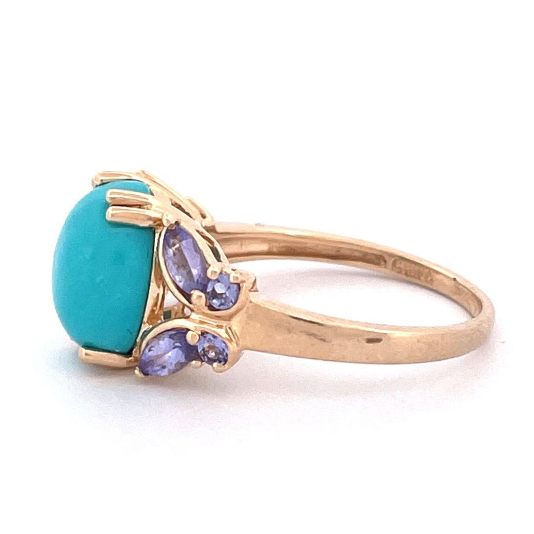 Unique 14k Yellow Gold Turquoise Butterfly Ring

Make a statement with this one-of-a-kind 14k yellow gold ring featuring an oval-shaped turquoise stone at its center. The stone is flanked by two tanzanite stones, creating the appearance of delicate