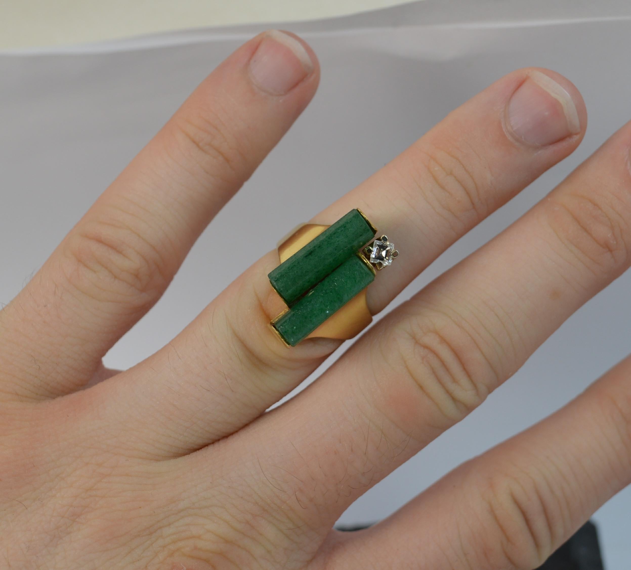 A stunning unique ring.
SIZE ; K 1/2 UK, 4 US
Solid 18 carat yellow gold example with white gold setting for diamond.

Designed with two cylinders of jade, 15mm long. With a single princess cut diamond, Vs1 clarity, E-F colour, 20 points.

Vintage