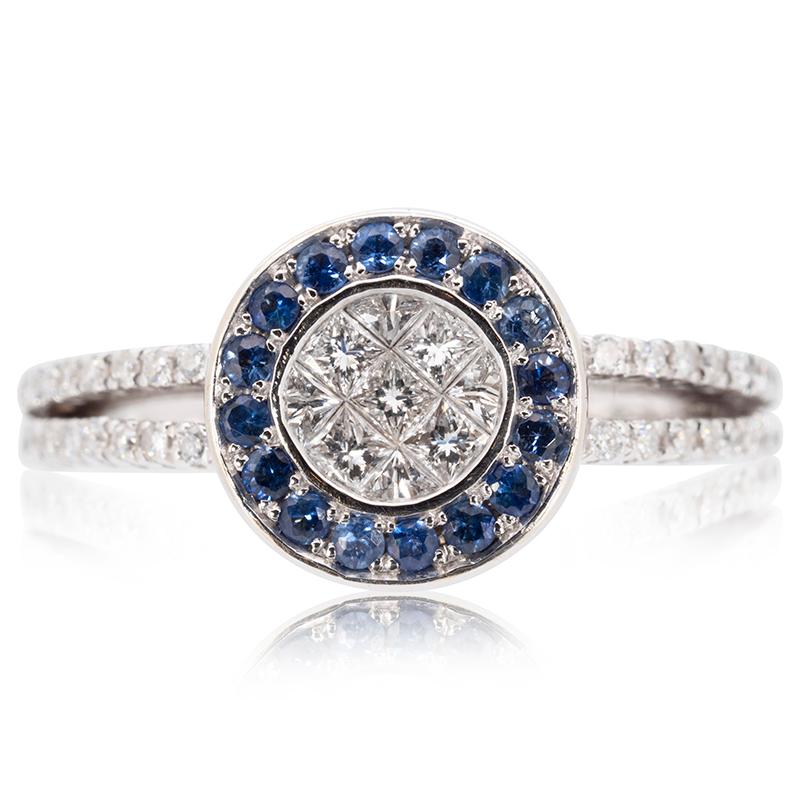 18K White Gold Diamond Ring with Sapphire Surrounding stones.

-7 diamond main stones of 0.03 ct. each, total: 0.21 ct.
cut: princess cut
color: G
clarity: VS

-16 sapphire side stones of 0.02 ct. each, total: 0.32 ct.
cut: brilliant-cut
color: