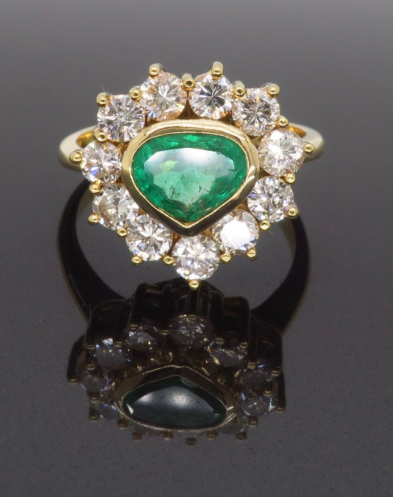 Unique 18k Yellow Gold Emerald and Diamond Halo Ring For Sale at 1stDibs