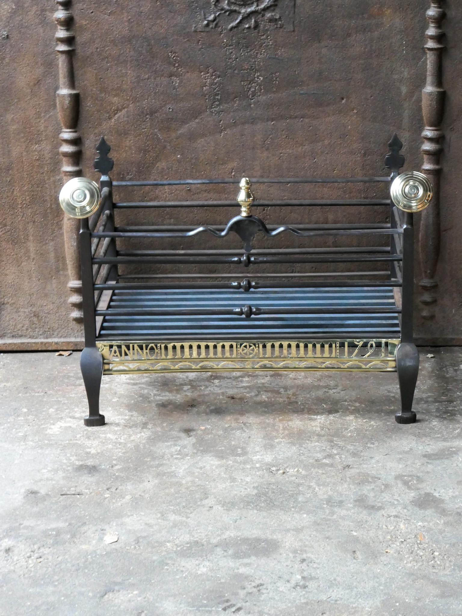 Impressive, unique 18th century Dutch Georgian fire grate made of wrought iron and polished brass. The grate has a natural brown patina. 







  