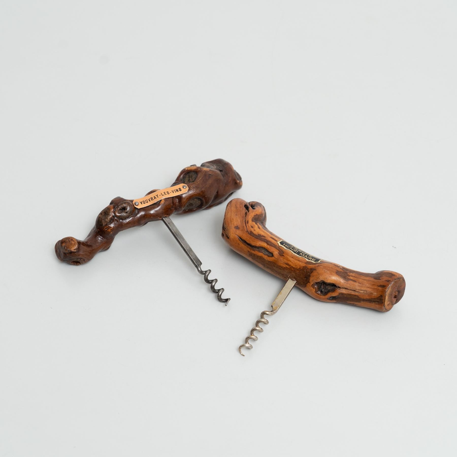 This rare set of two corkscrews, handcrafted in the 1930s by French artisan Laurent Siret, showcases the beauty of traditional craftsmanship. Made from vine wood, each corkscrew is unique, with slightly different measurements and shapes that