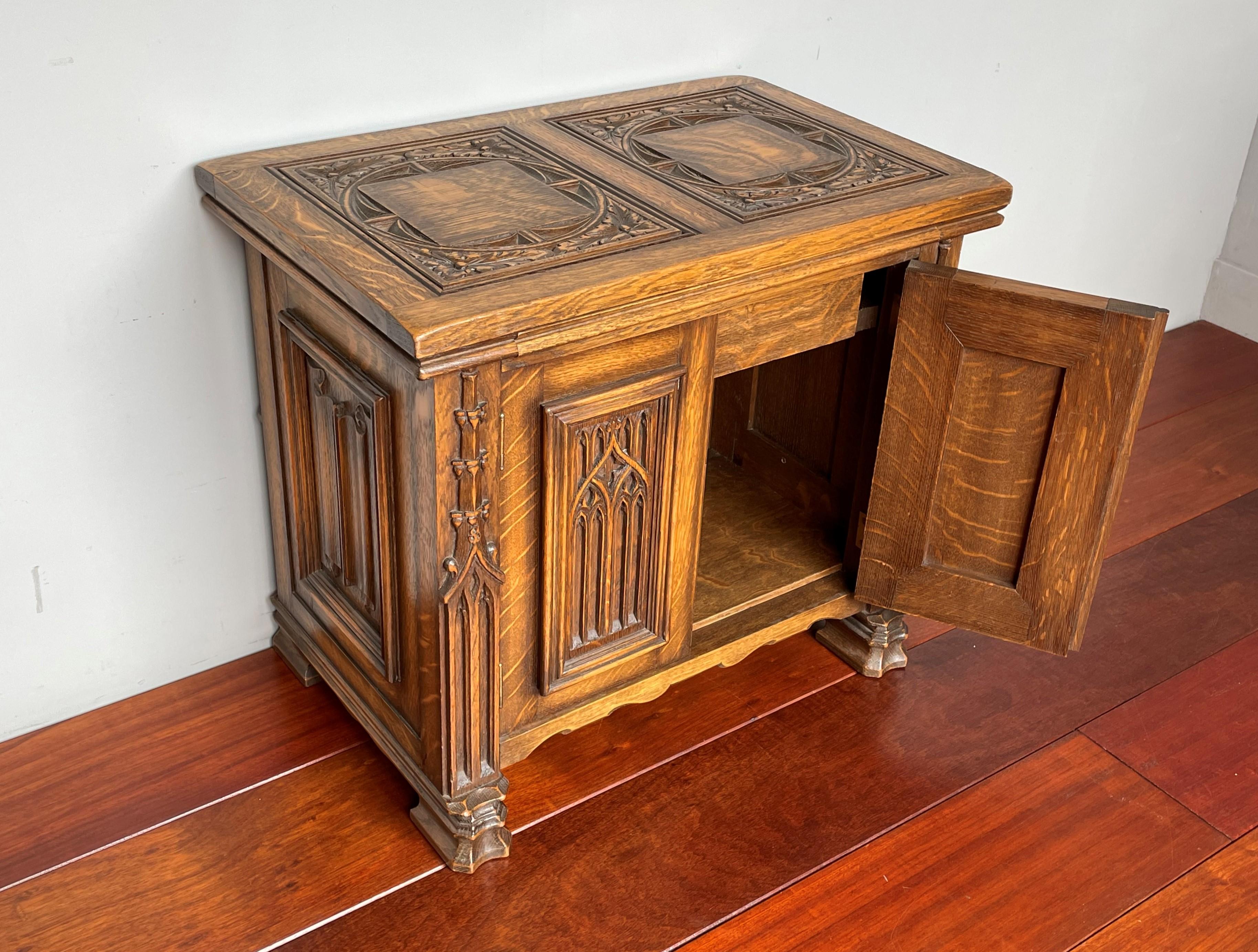 Stunning little, multi purpose Gothic cabinet from a monastery.

This here Gothic cabinet is one of the smallest yet most stylish we ever had the pleasure of offering. It is entirely hand-crafted and hand carved out of solid tiger oak and it has a