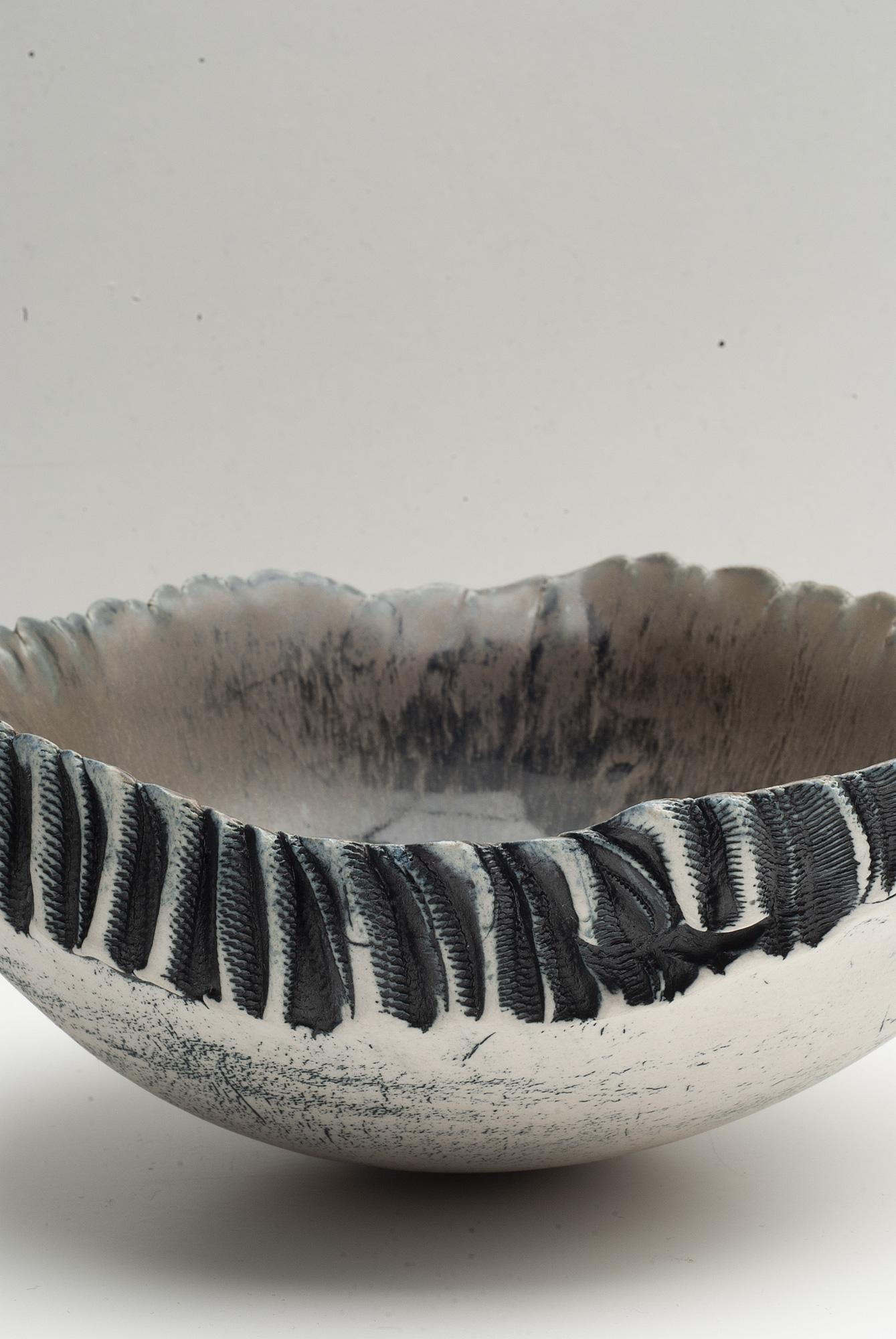 A unique and handmade 1960s bowl by Swedish artist Bengt Berglund for Gustavsberg. The exterior of the bowl is partially glazed, the interior glazed in ocher and black.

Berglund worked for Gustavsberg Studio between 1960 and 1982.