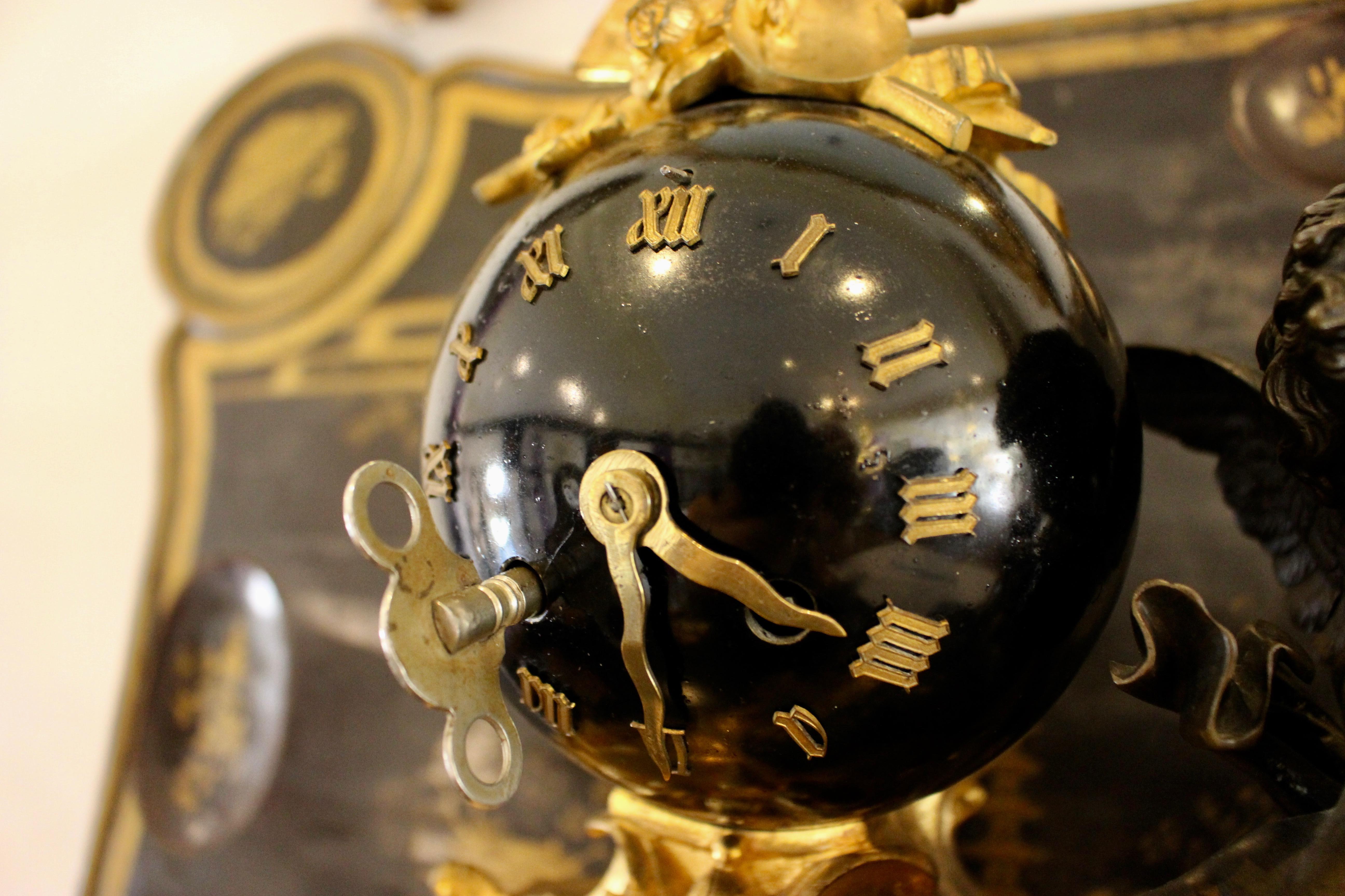 Unique 19th century Empire-style gilt and patinated figural clock depicting ormolu cherub recombinant.