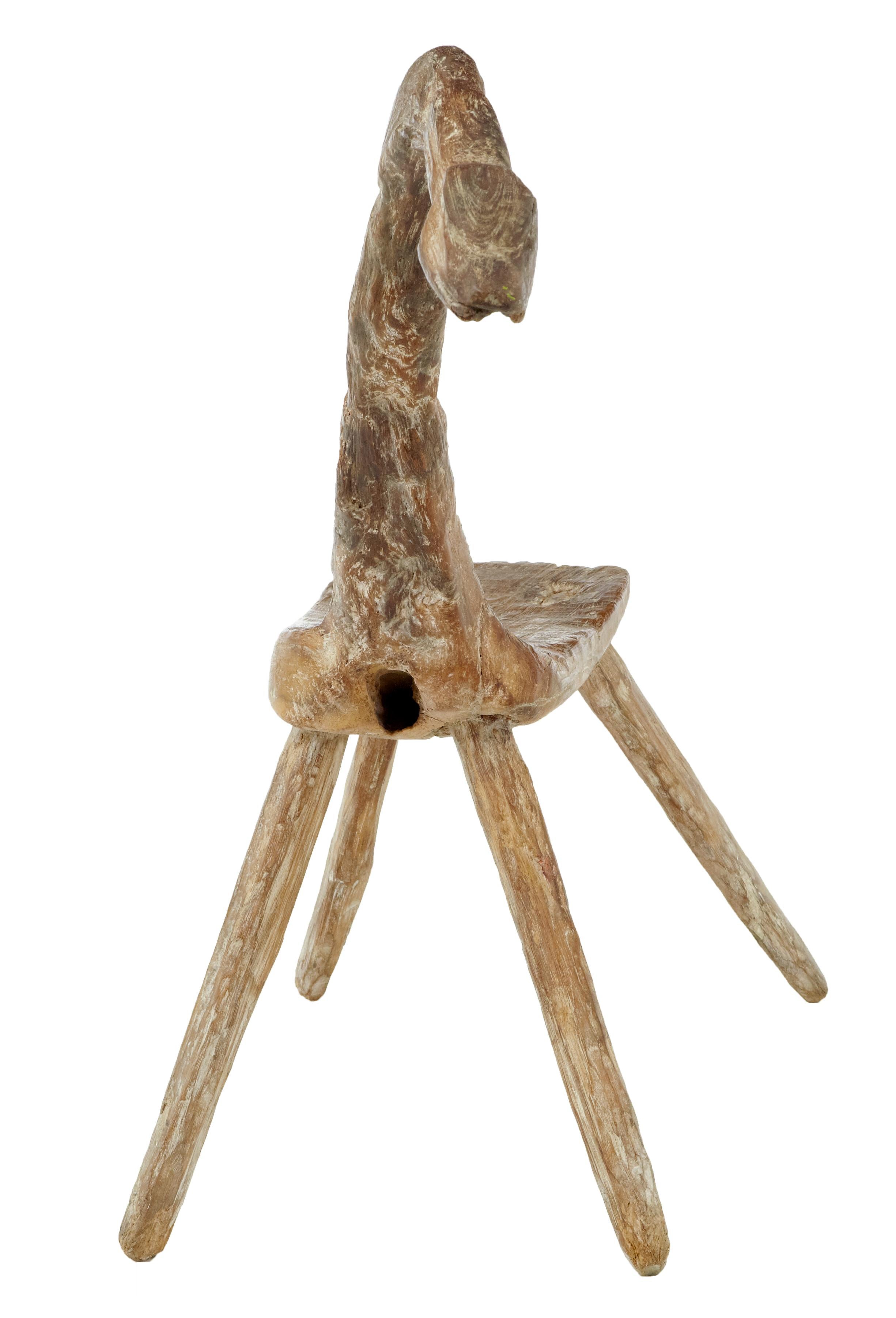 Unique 19th century natural form oak child’s stool, circa 1880.

Rare children's stool in the form of a long necked bird, horse or dinosaur, made from oak in its natural shape, with doweled in legs.

Expected surface marks.

Measures: Seat