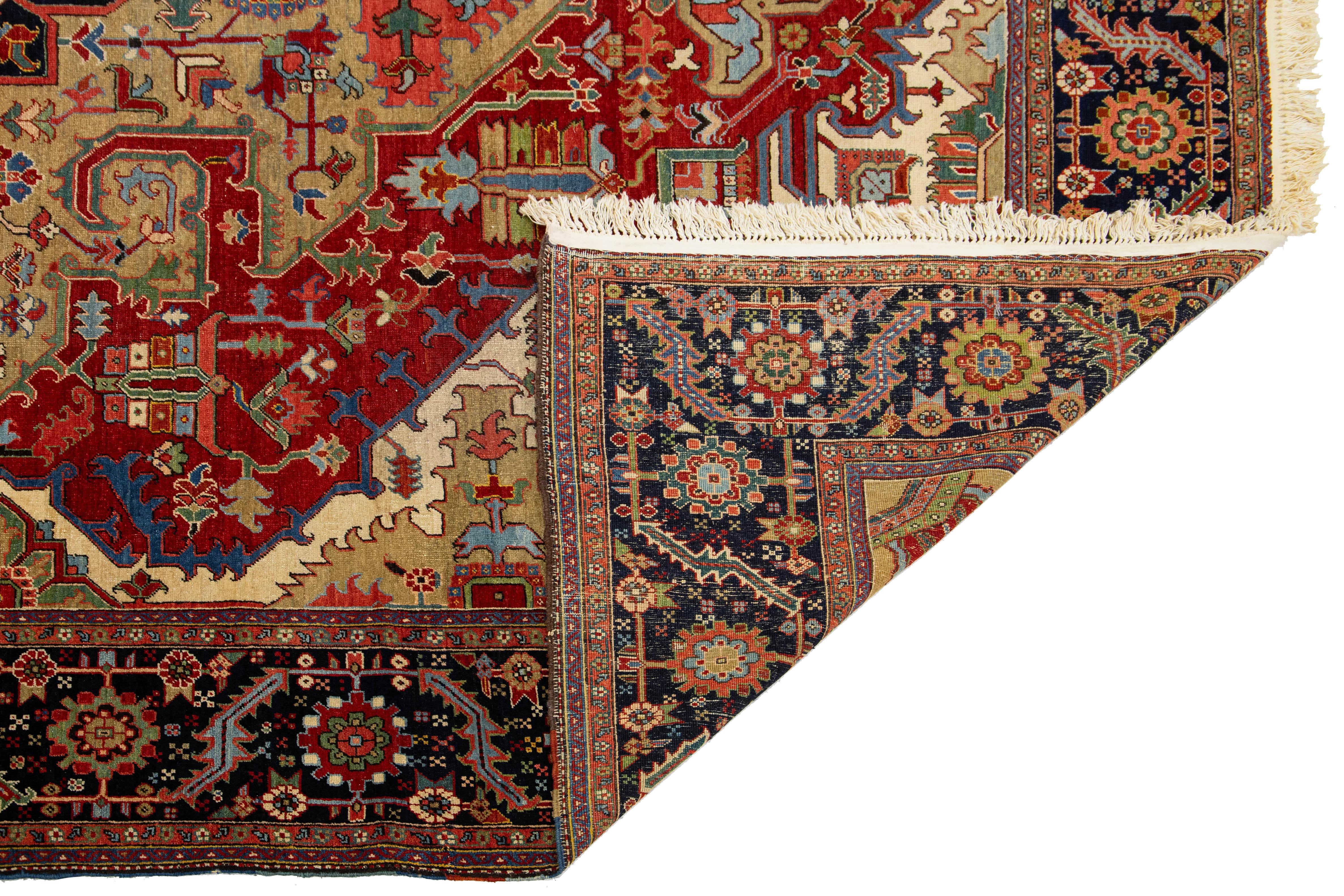 Heriz Serapi Unique 19th Century Persian Serapi Wool Rug Featuring a Red Medallion Design For Sale
