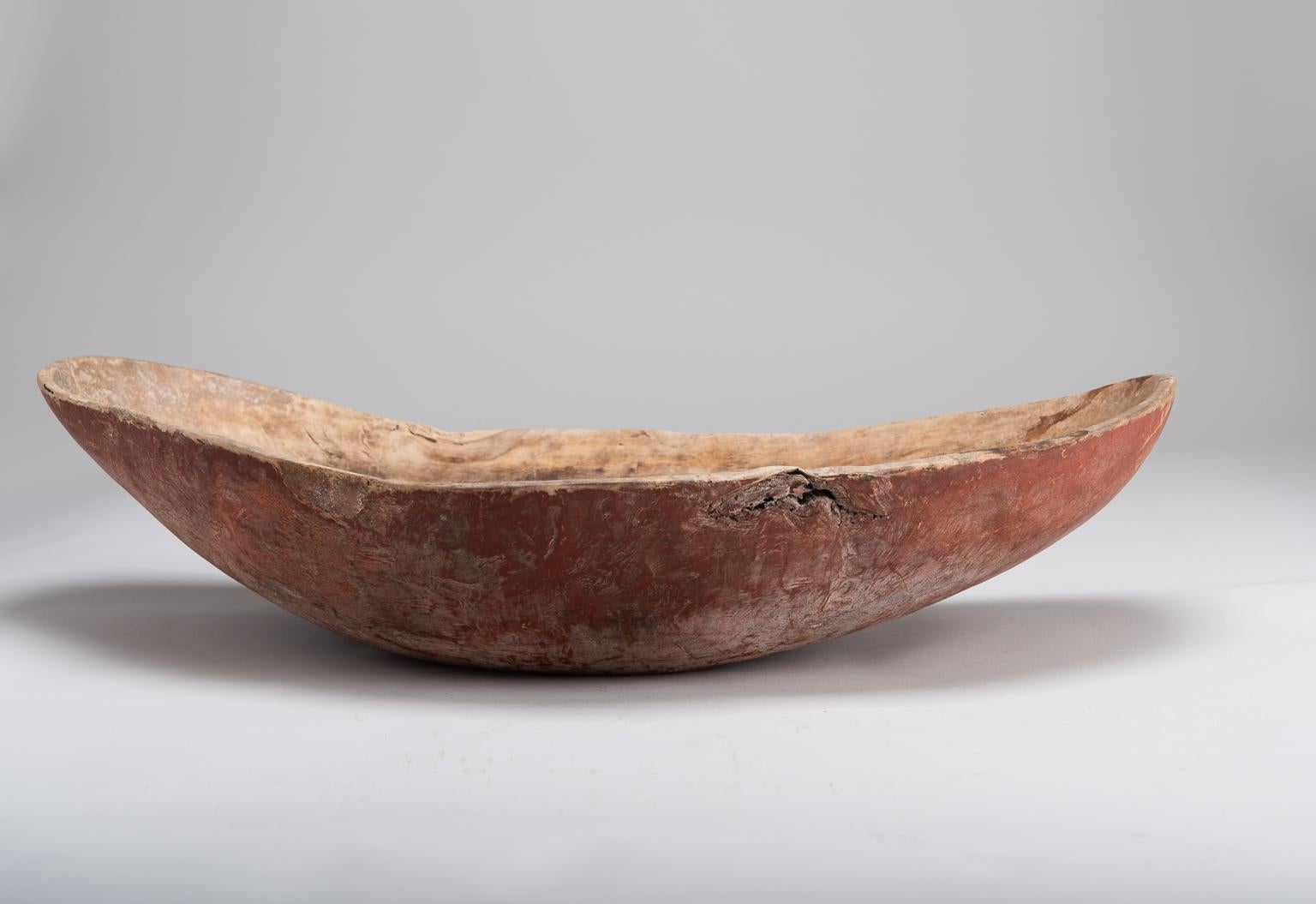 Unique wooden bowl from northern Sweden. The bowl is unusually large and has an organic shape. The surfaces are naturally patinated due to age. The bowl is in original condition and with original paint. Carved monogram and year 1836 carved