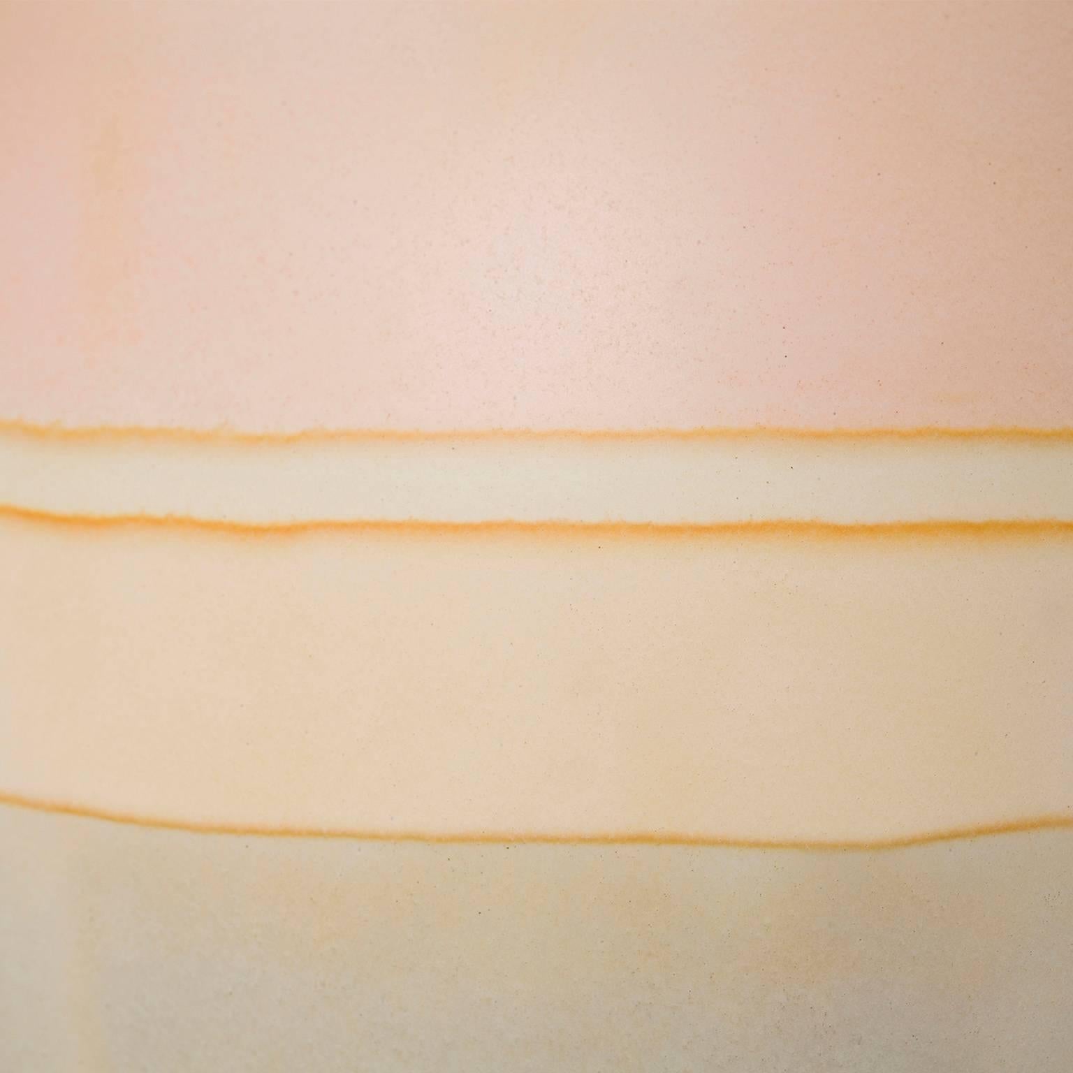 This gorgeous and unusual vase is handmade by artist Elyse Graham in her Los Angeles studio.

This collection of vessels is inspired by striated landscapes caused by glacial erosion as well as the beautiful colors found in foliated metamorphic