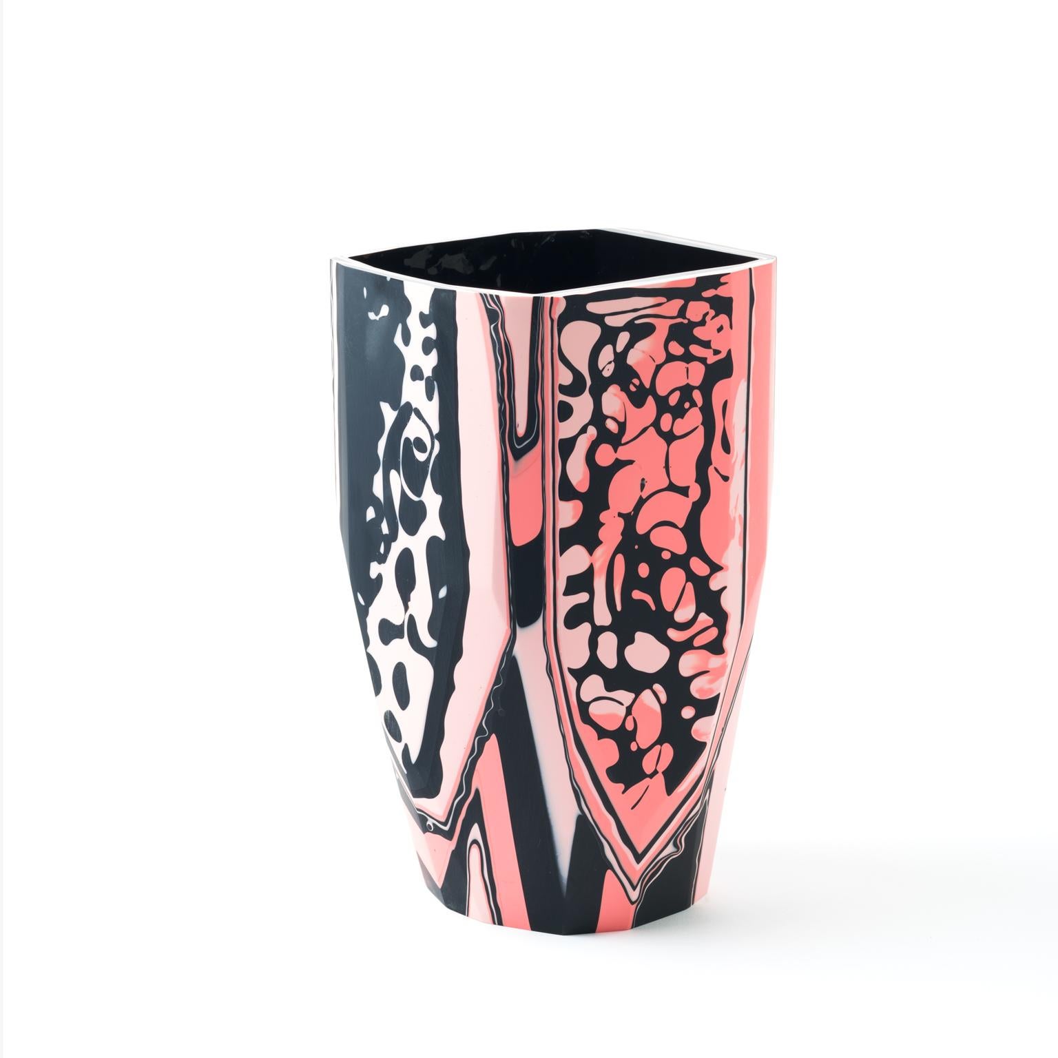 The fanciful and striking Nakuru Vase is a new addition to our Black Magic collection of resin vessels, inspired by the concept of revealing that which has been hidden from sight, but remains ever-present.

Gazing toward the past, to cultures and